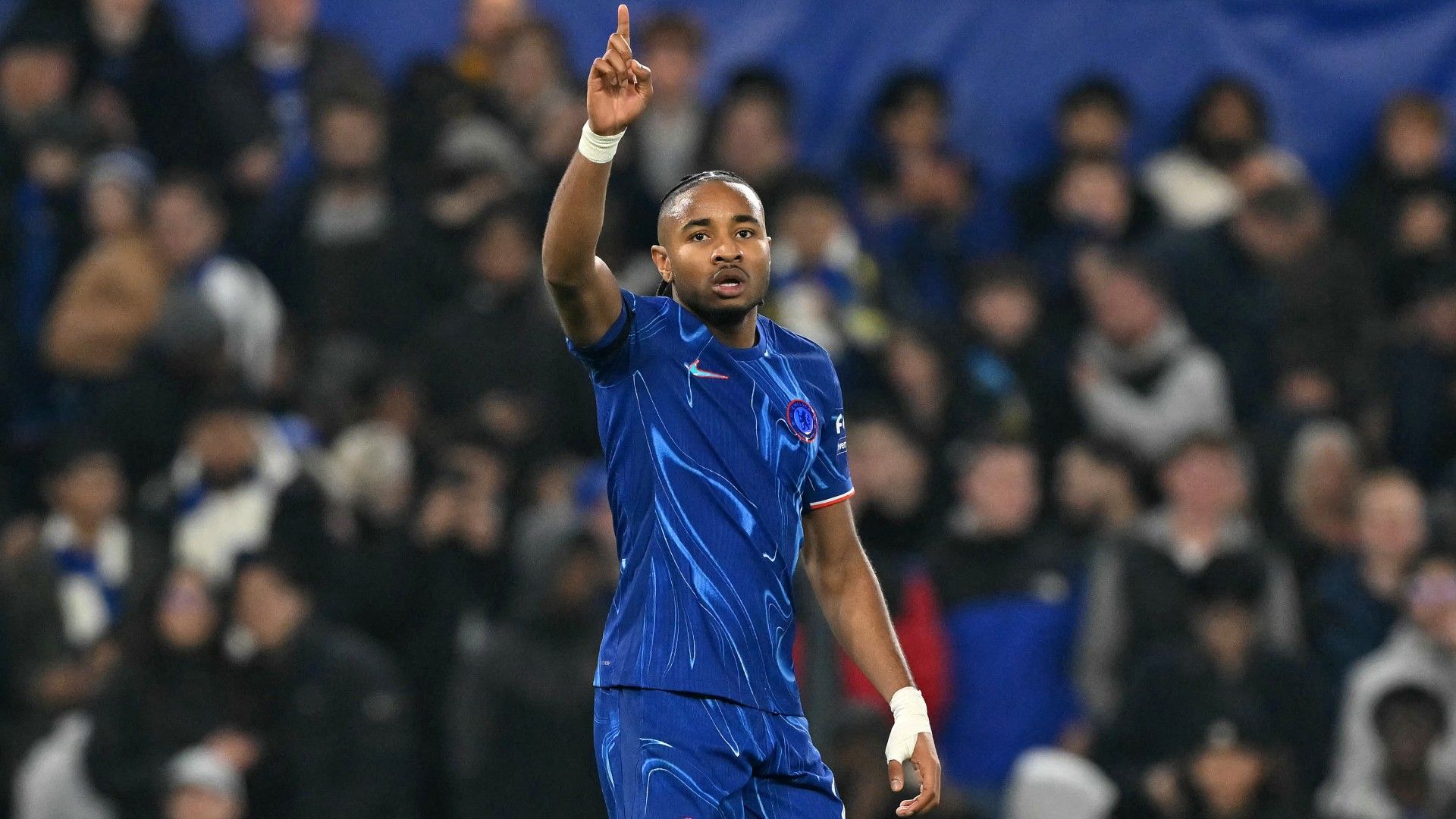 Chelsea's French striker #18 Christopher Nkunku celebrates scoring 
