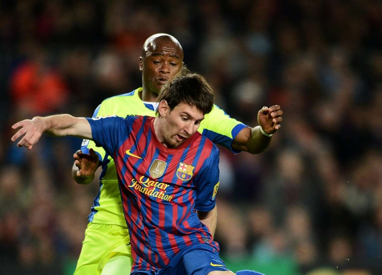 Tsepo Masilela and Lionel Messi