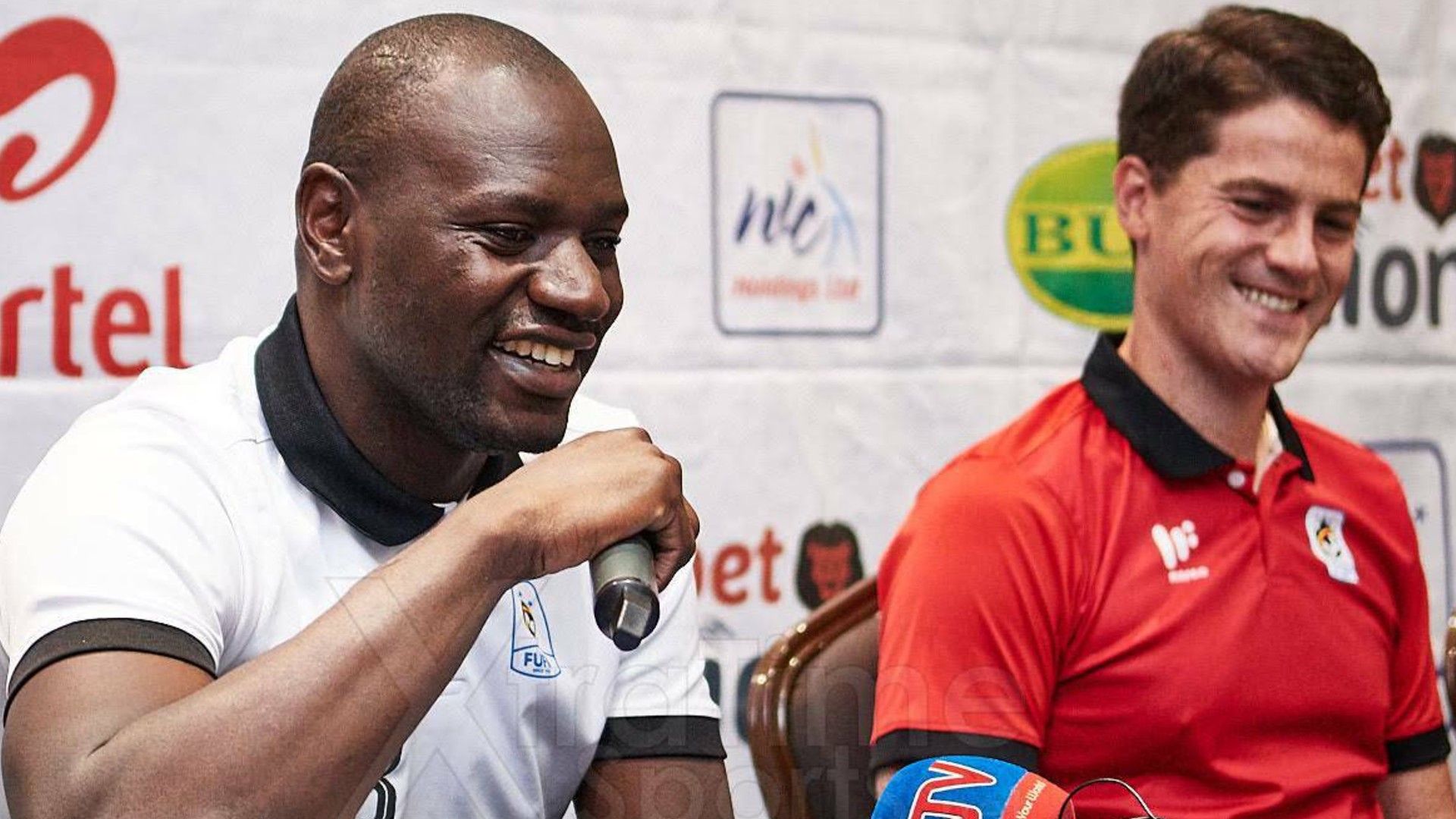 Uganda keeper Denis Onyango and Johnathan McKinstry.
