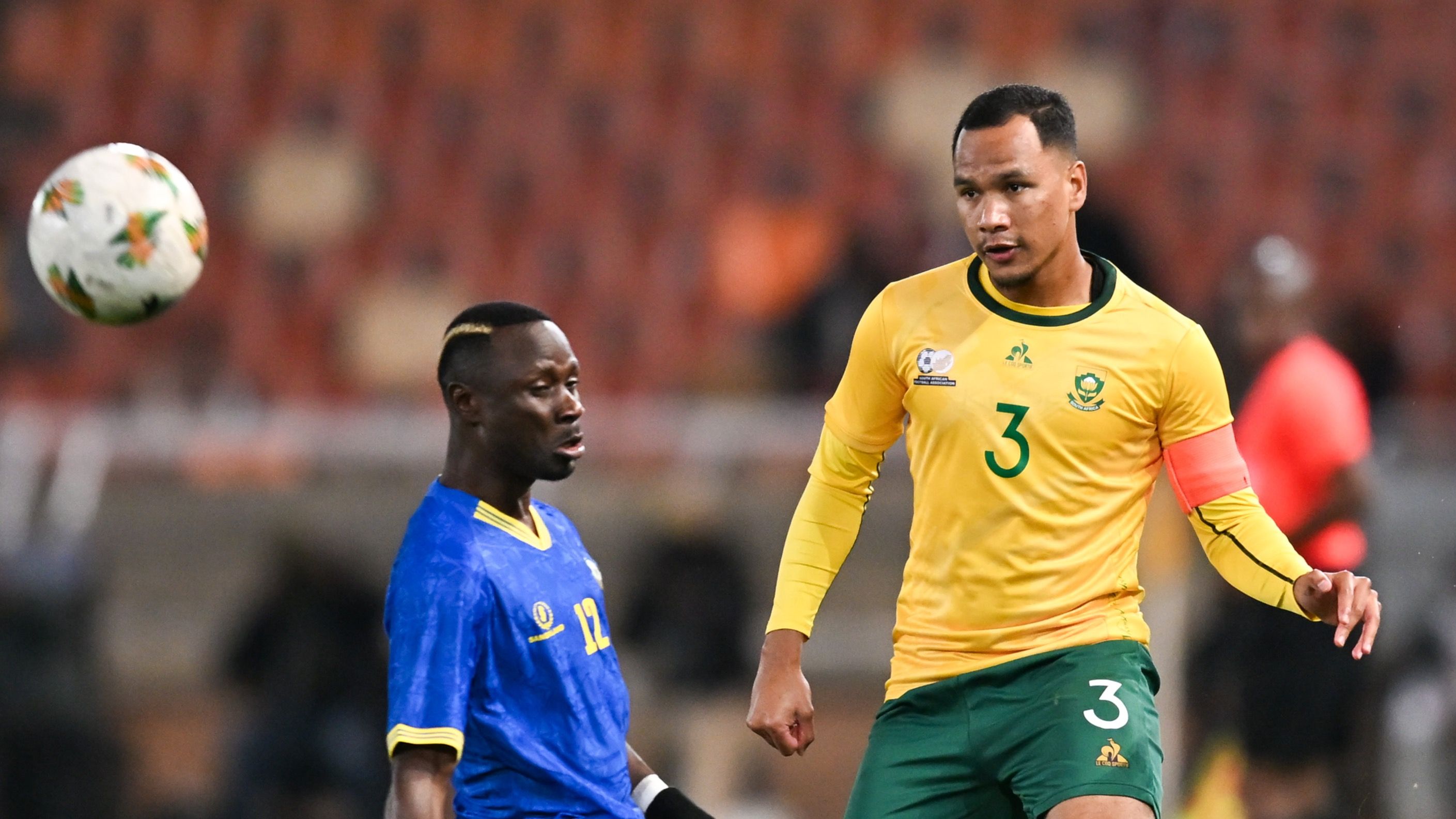 Fawaaz Basadien of Bafana Bafana & Simon Msuva of Tanzania