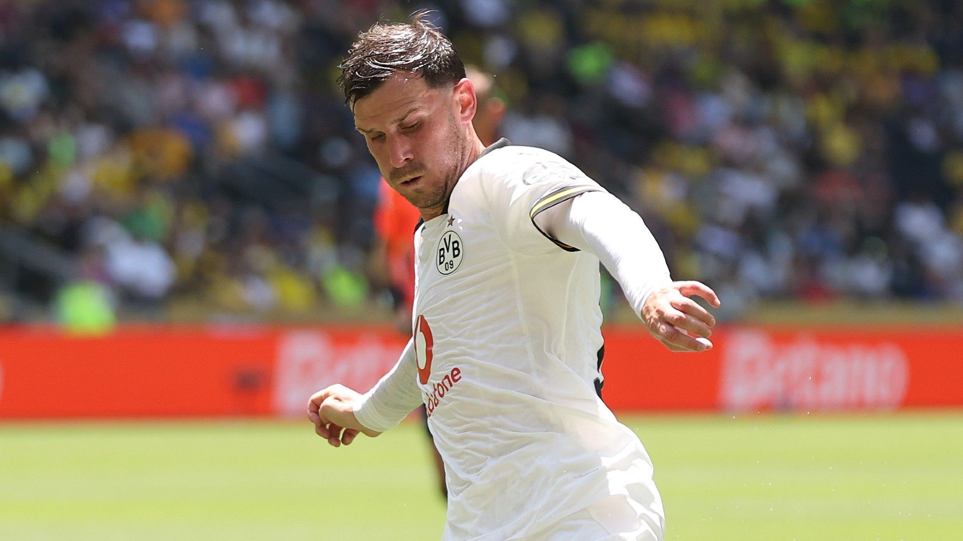 Pascal Gross #13 of Borussia Dortmund passes the ball 