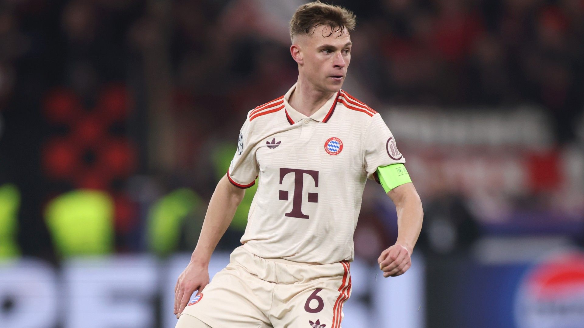 Joshua Kimmich of Bayern Muenchen controls the ball