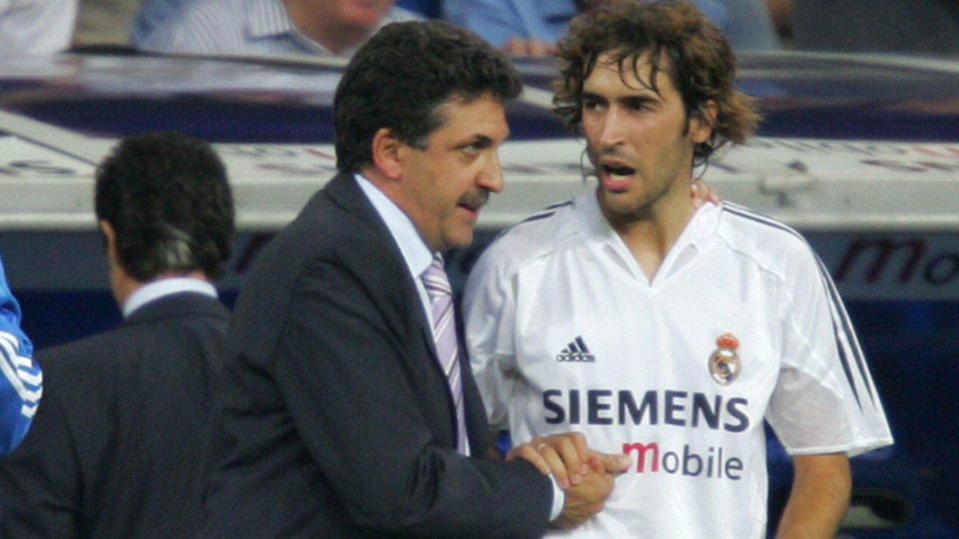 Real Madrid's Raul congratulates team's new coach Mariano Garcia Remon