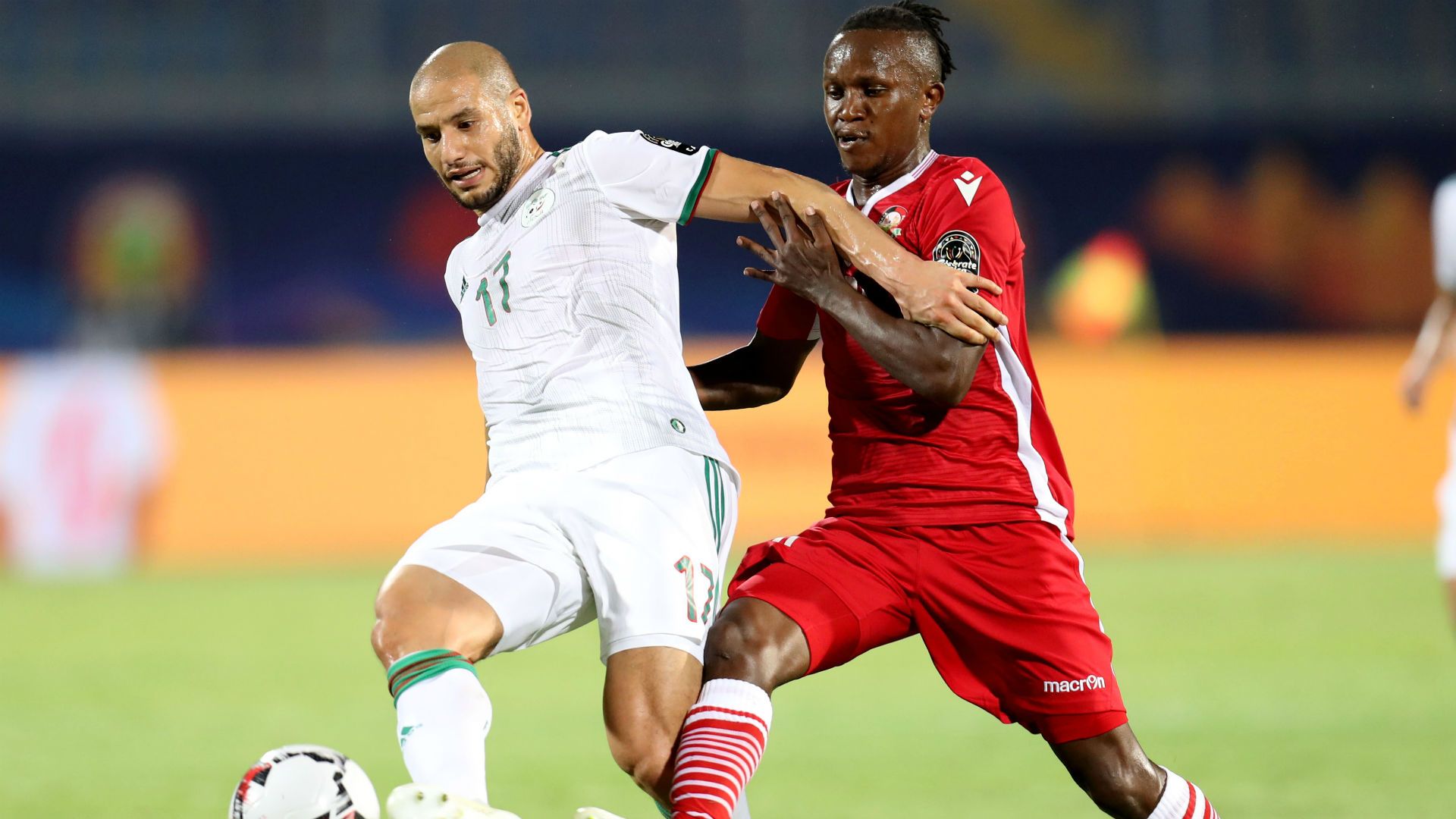 Adlane Guedioura of Algeria challenged by Francis Kahata of Kenya.