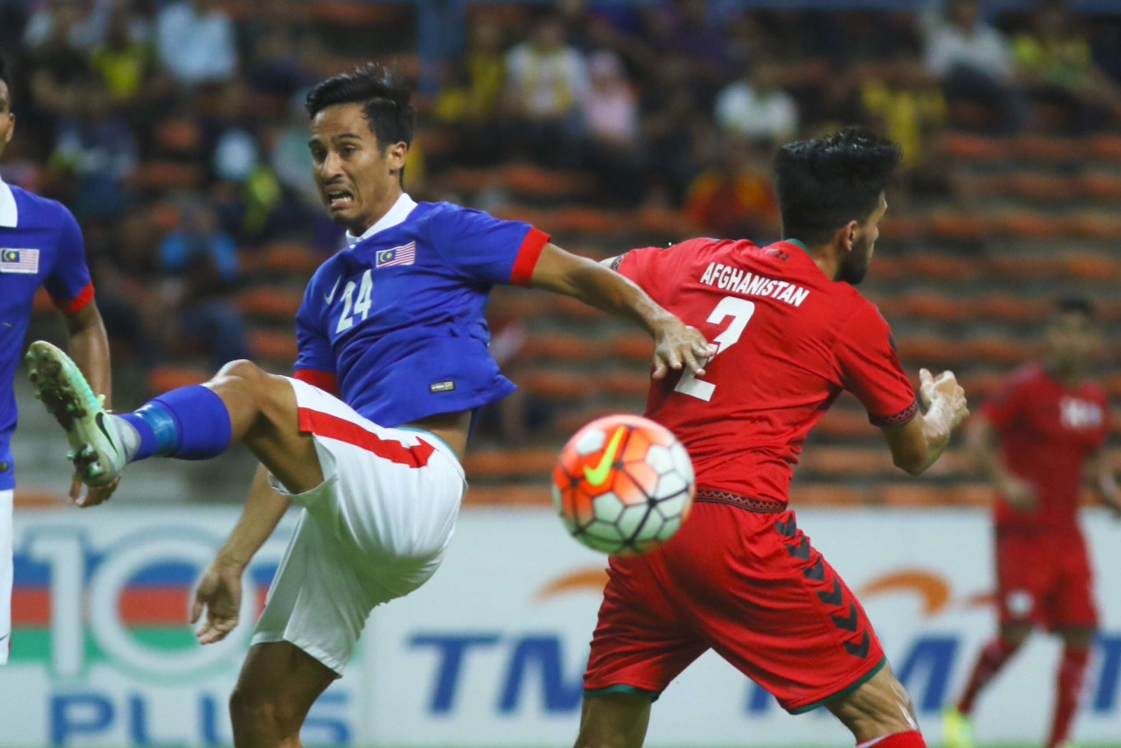 Malaysia's Matthew Davies (left) vies for the ball with an Afghanistan player 11/10/2016
