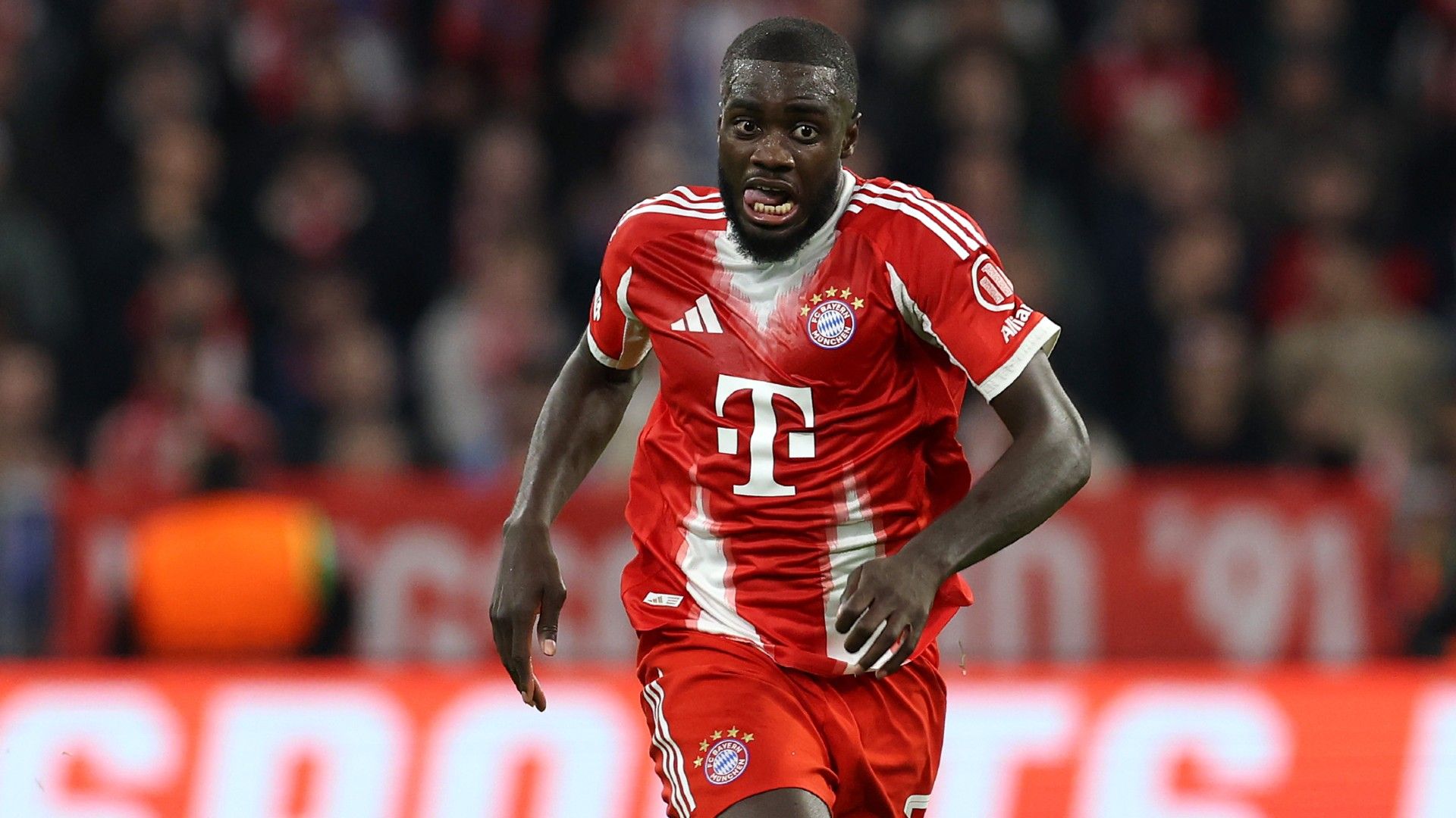 Dayot Upamecano of FC Bayern München runs with the ball 