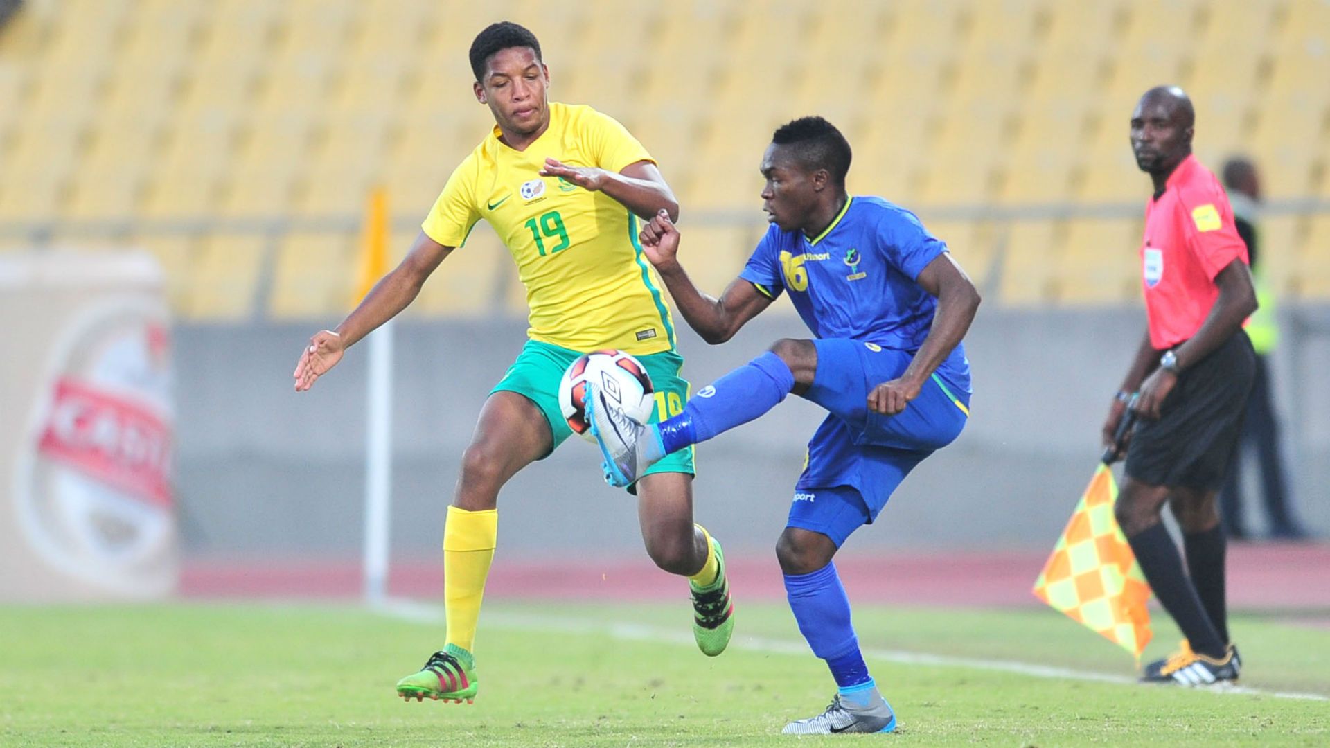 Jamie Webber of South Africa challenged by Yahya Ramadhani of Tanzania