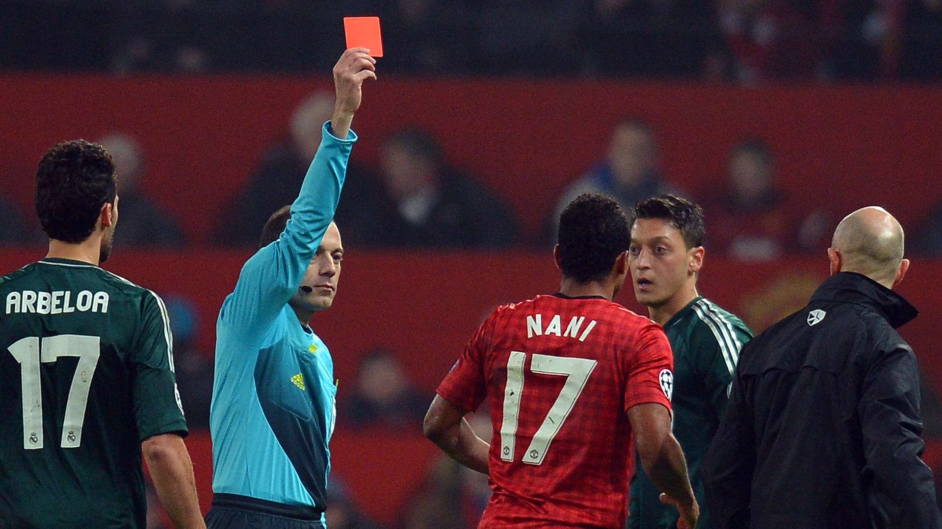 Referee Cuneyt Cakir shows Nani the red card s Nani the red card to send him off during he UEFA Champions League Manchester United and Real Madrid at Old Trafford 2013