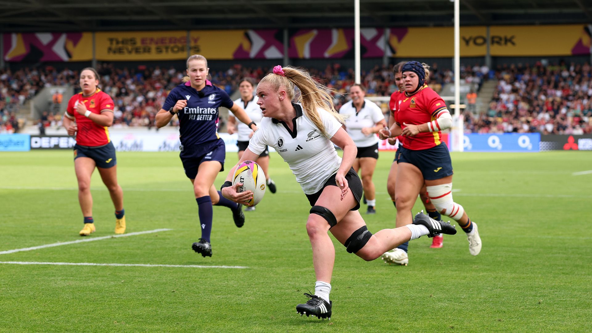 Jorja Miller of New Zealand runs with the ball before scoring her team's first try during the Women's Rugby World Cup 2025