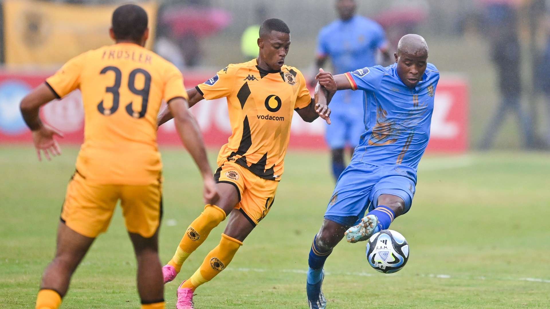 Ashley du Preez of of Kaizer Chiefs FC challenges Thabo Matlaba of Royal AM FC, 2024