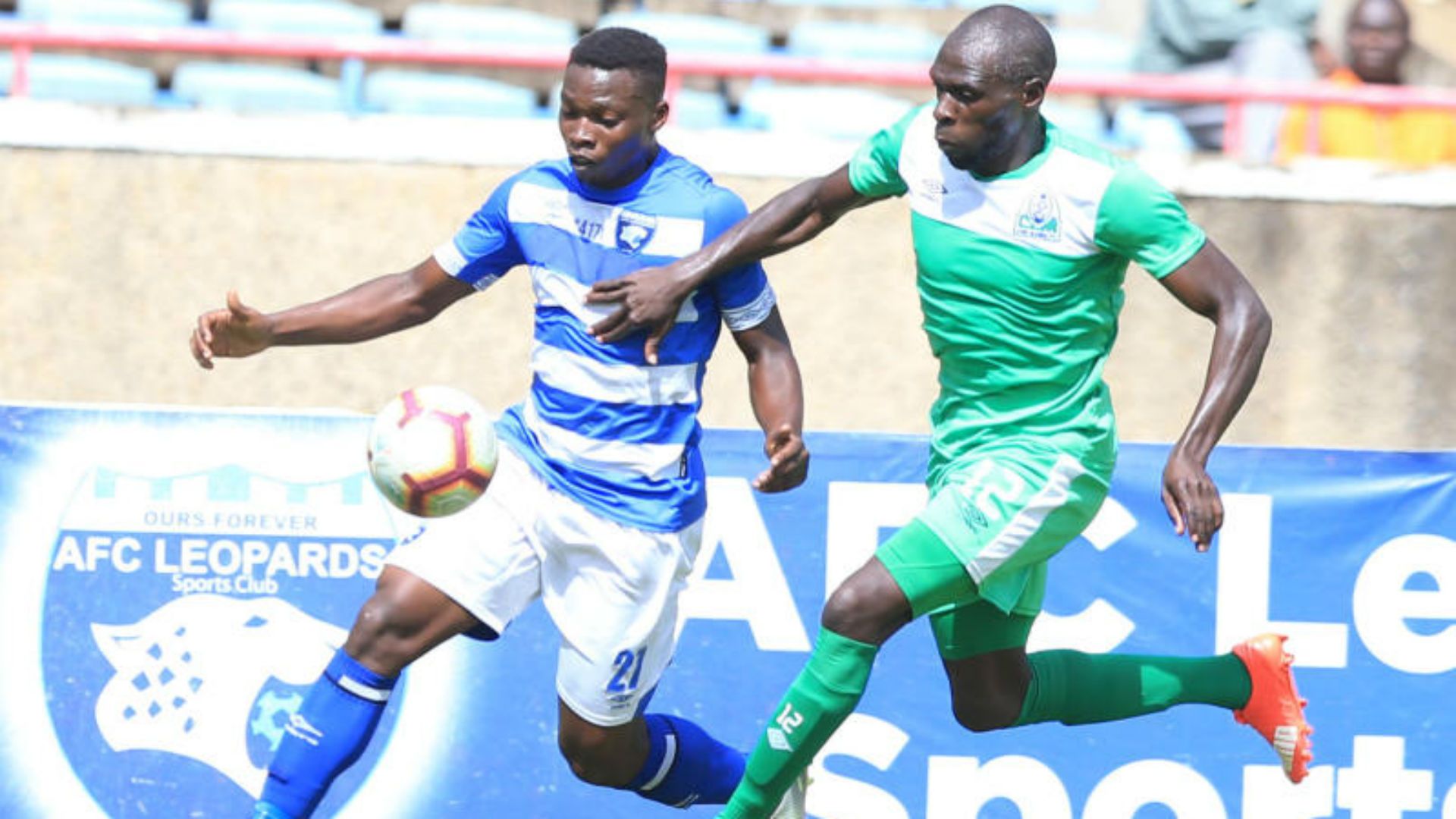Collins Shichenje (L) of AFC Leopards SC challenge Joash Onyango of Gor Mahia FC.