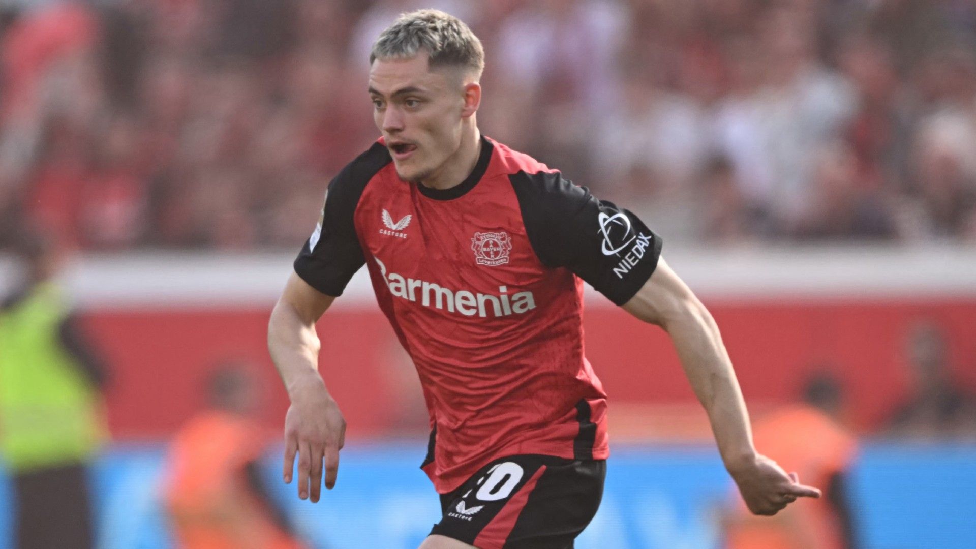 Bayer Leverkusen's German midfielder #10 Florian Wirtz plays the ball