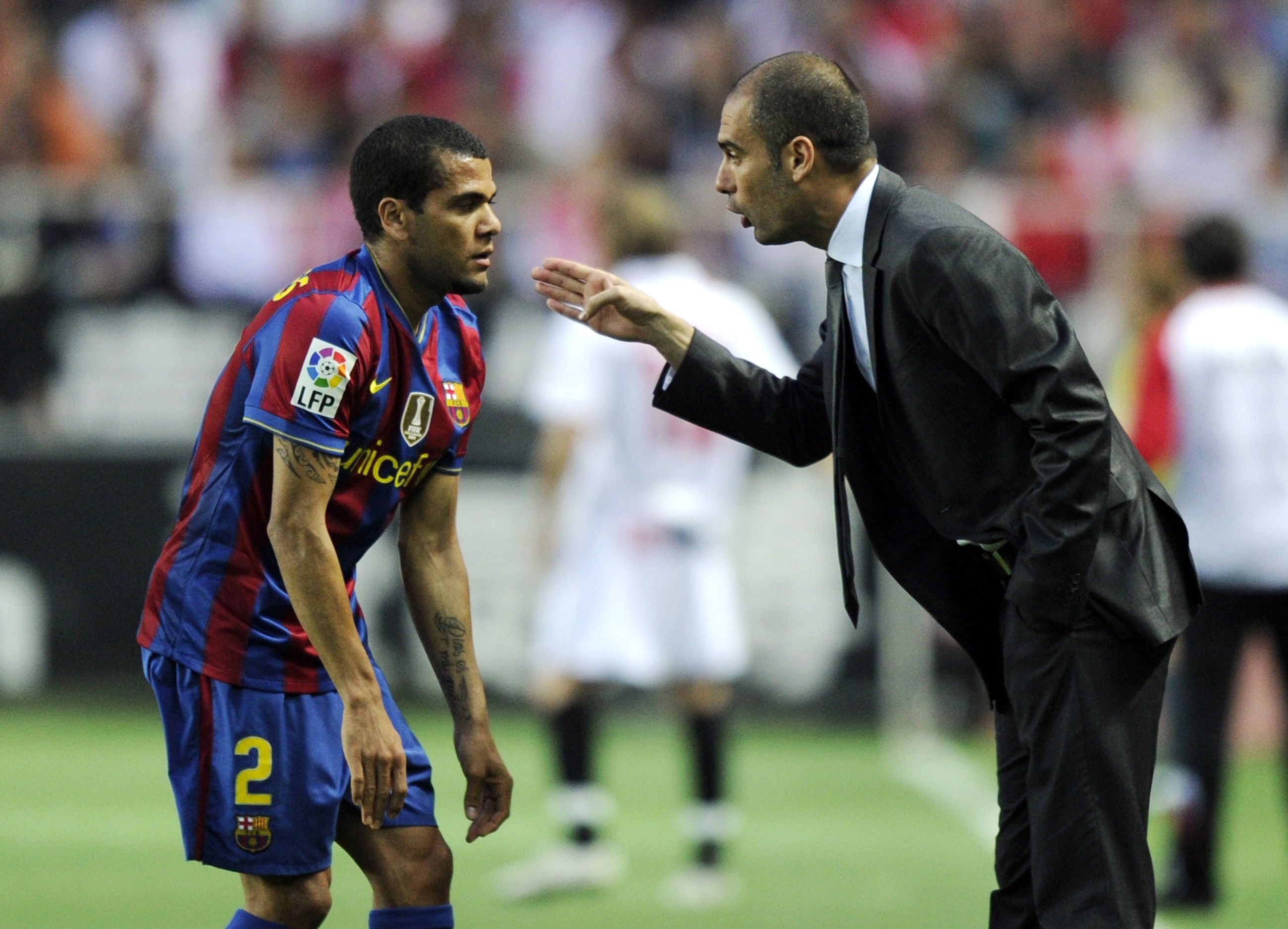 Then-Barcelona coach and player, Guardiola and Alves