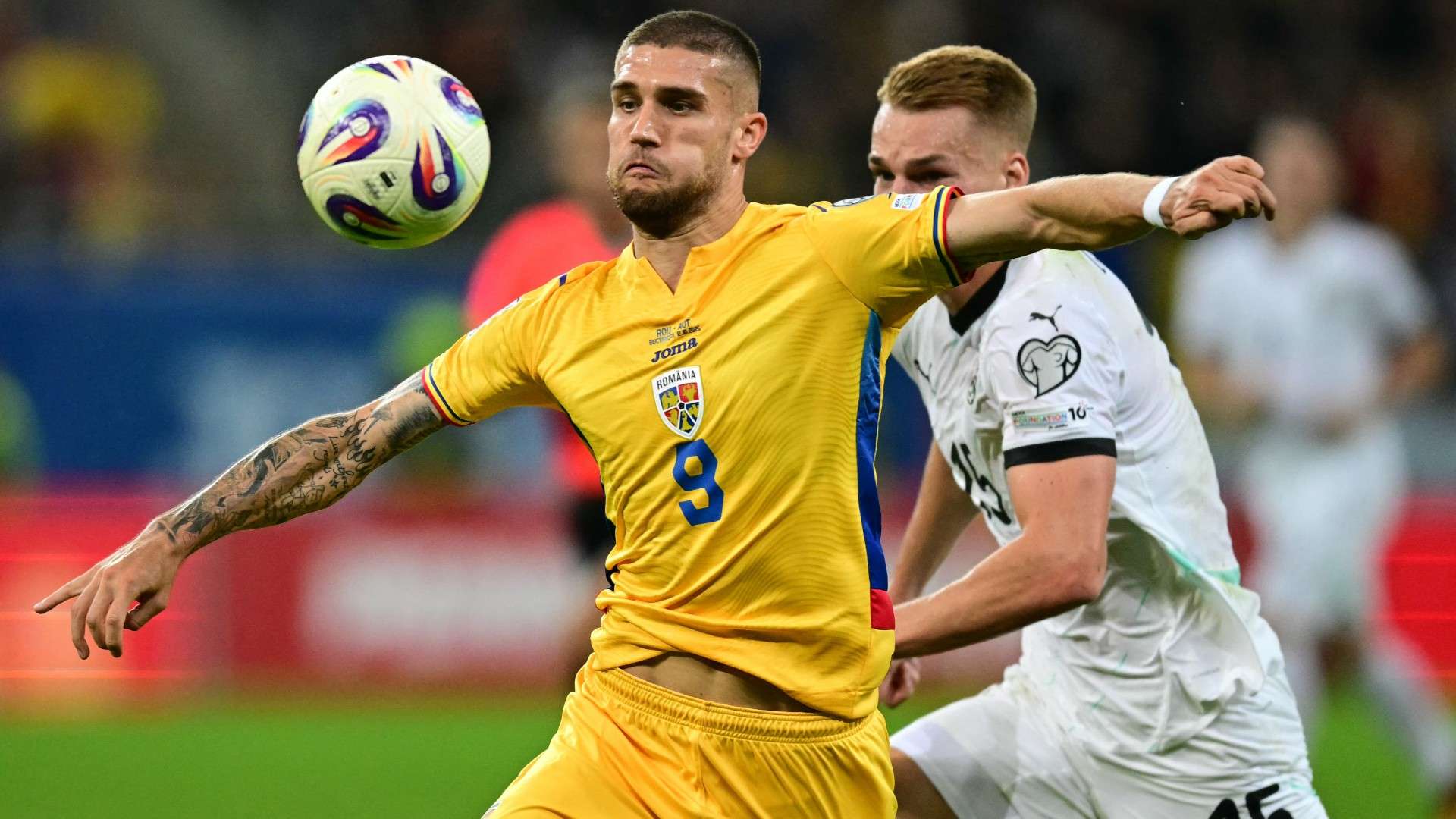 Austria's defender #15 Philipp Lienhart (R) and Romania's forward #09 Daniel Birligea