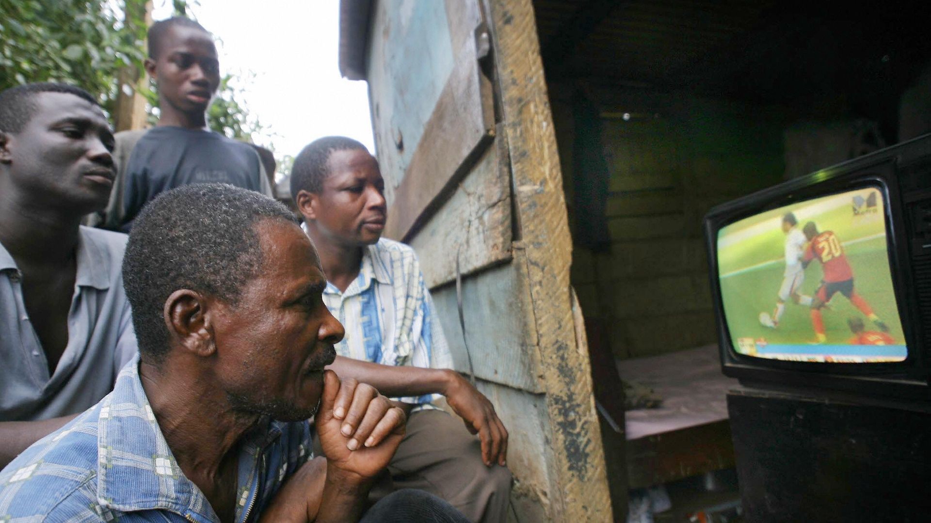 Ghana football fans watch television