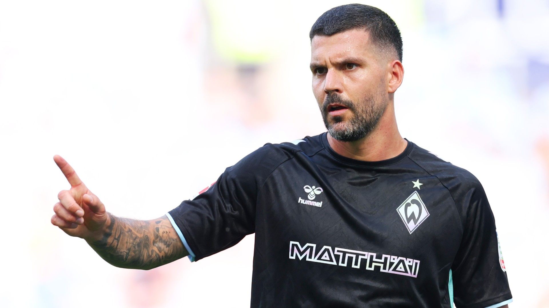 Anthony Jung of Werder Bremen gestures