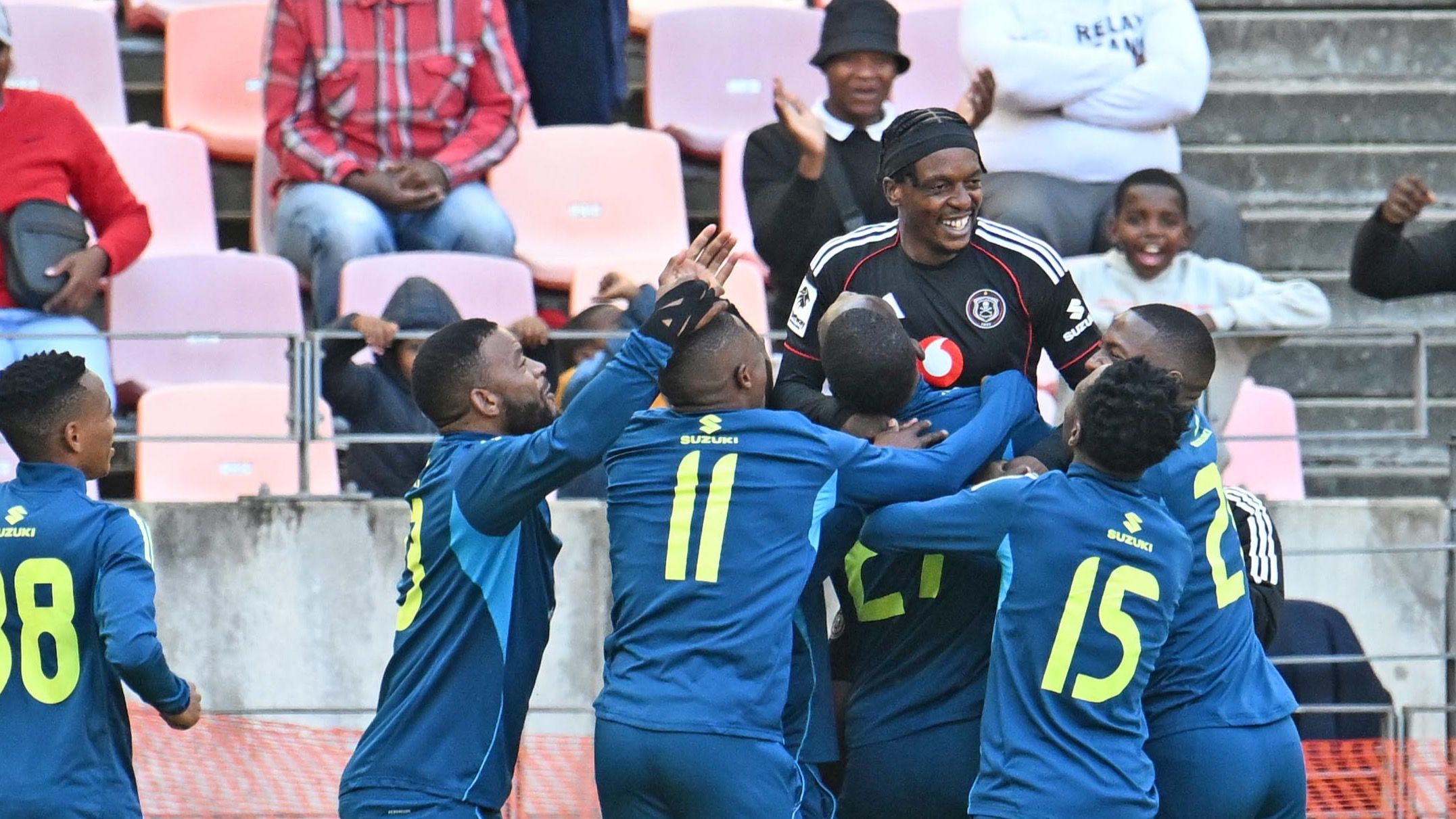 Patrick Maswanganyi of Orlando Pirates celebrates with teammates