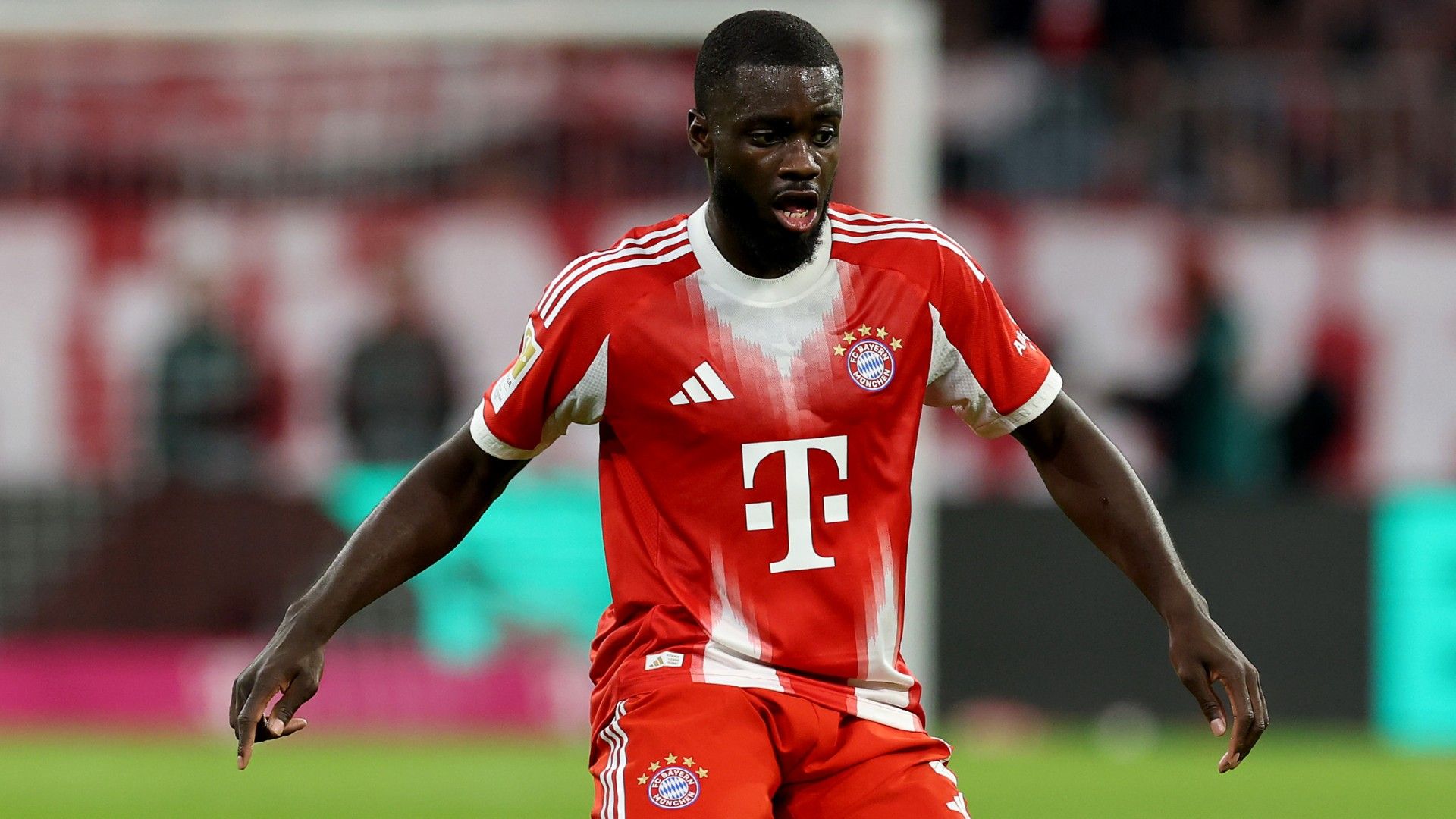 Dayot Upamecano of FC Bayern München runs with the ball