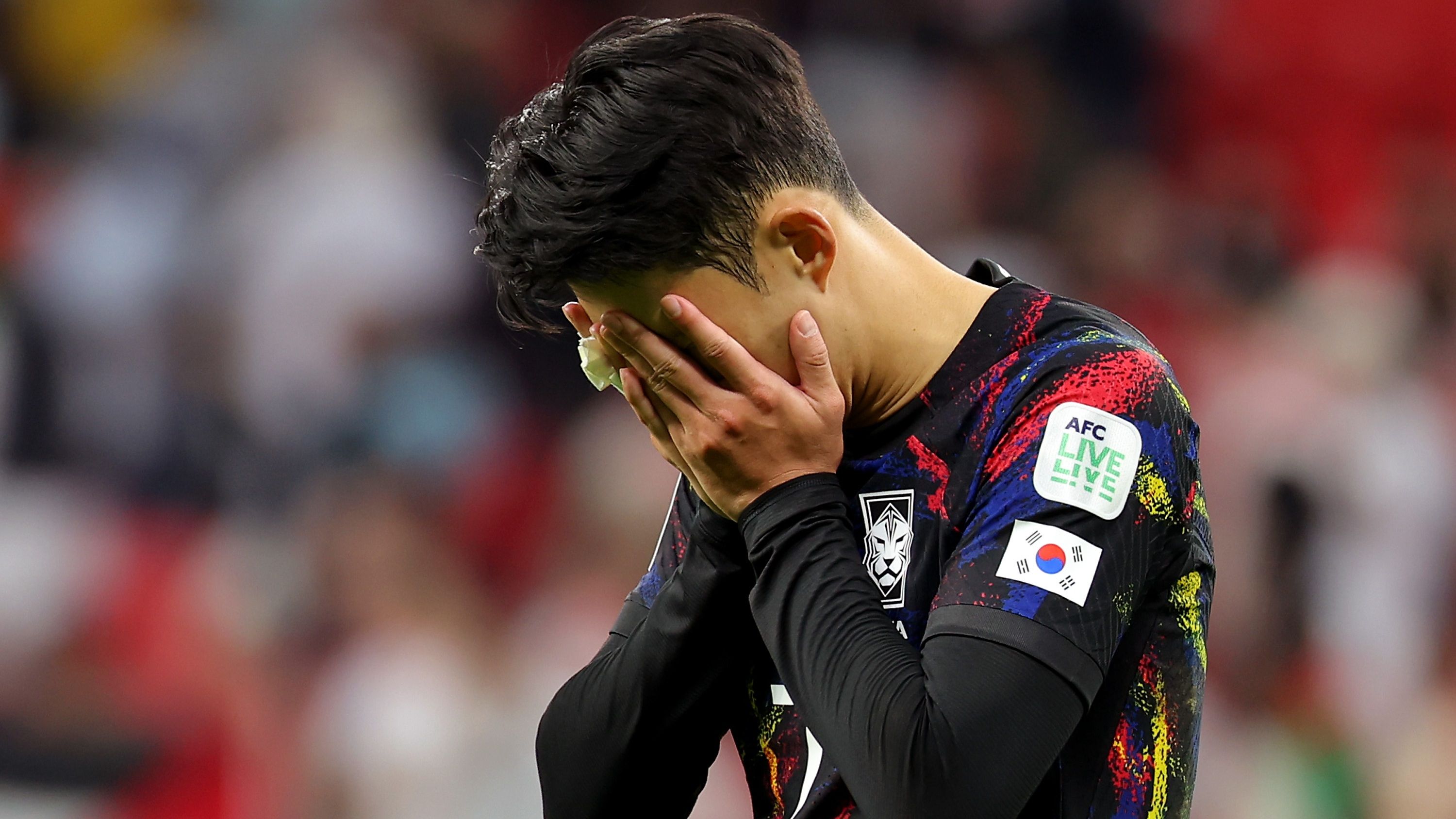 Son Heung-min of South Korea stands dejected