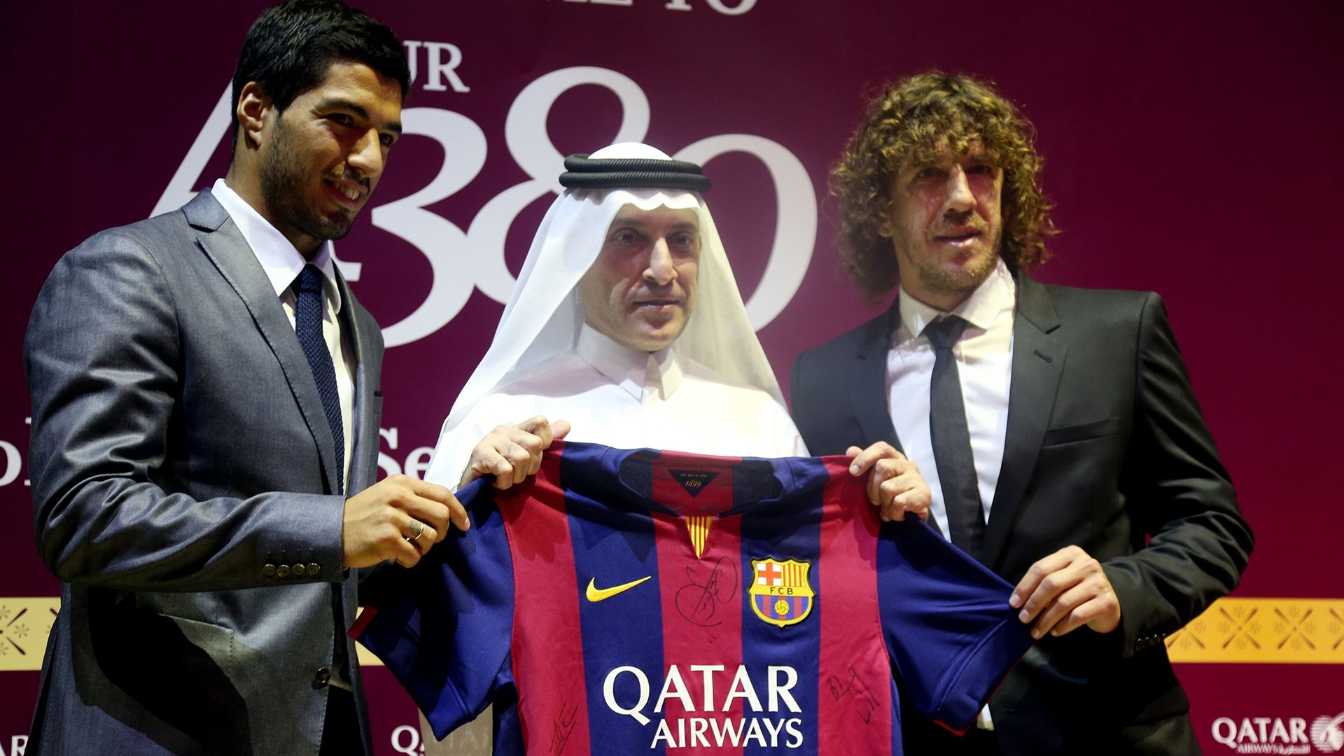 Luis Suarez Carles Puyol Barcelona Qatar Airways shirt