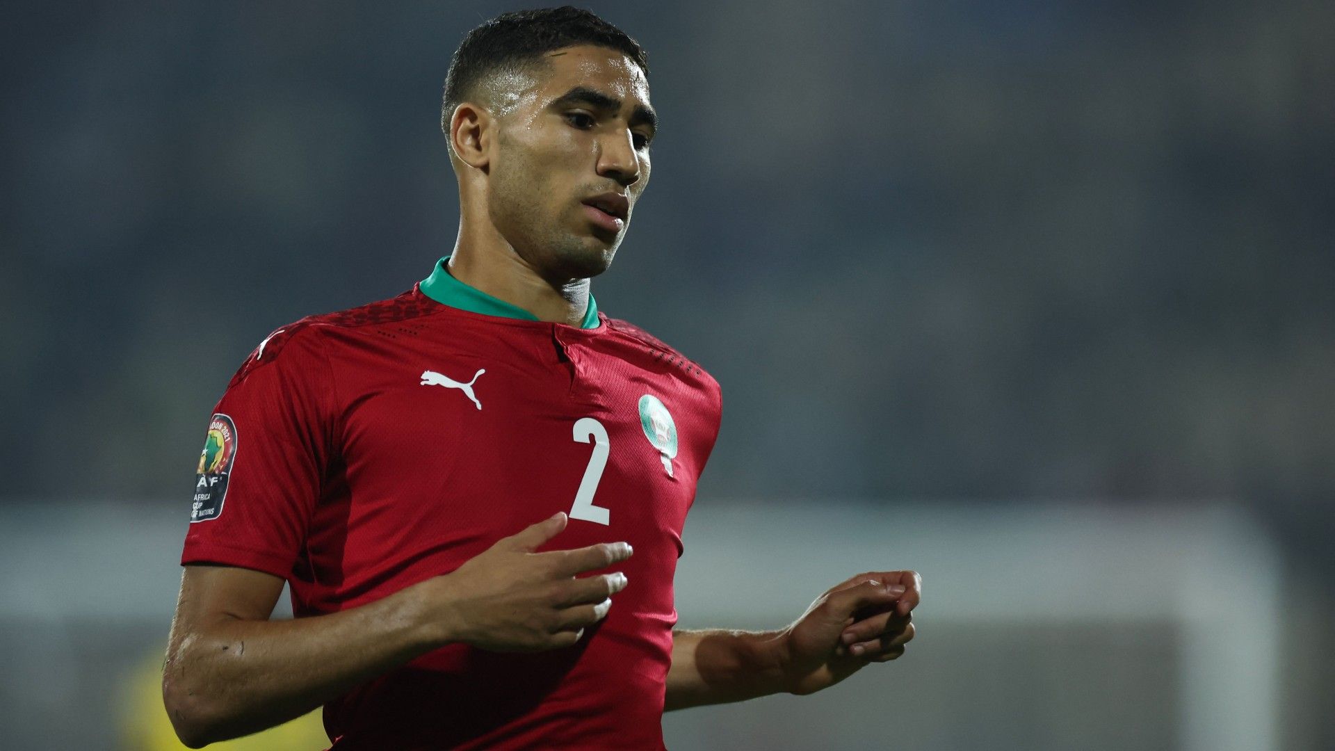 Morocco's defender Achraf Hakimi runs on the field 