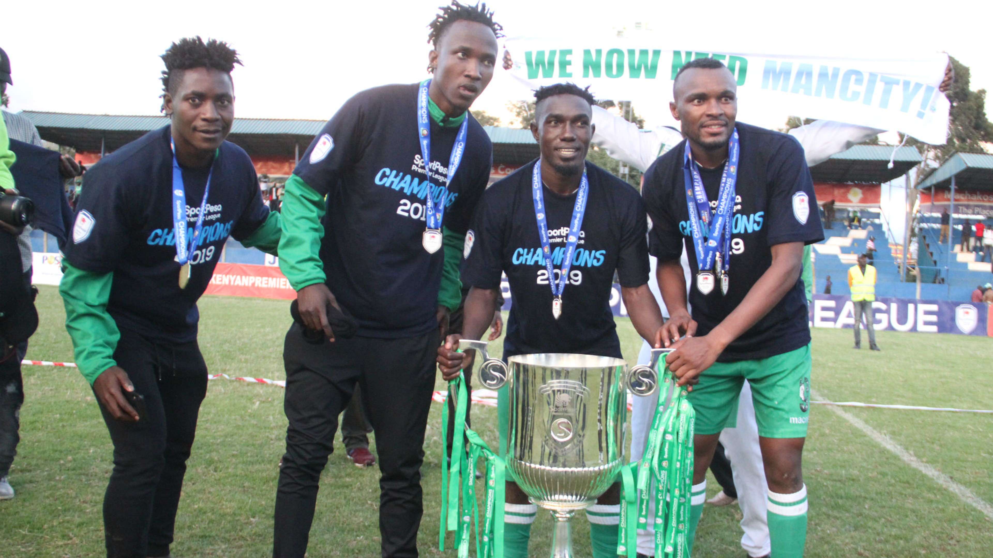 Hashim Sempala Erisa Ssekisambu Jacques Tuyisenge and Shafik Batambuze of Gor Mahia with KPL Trophy.