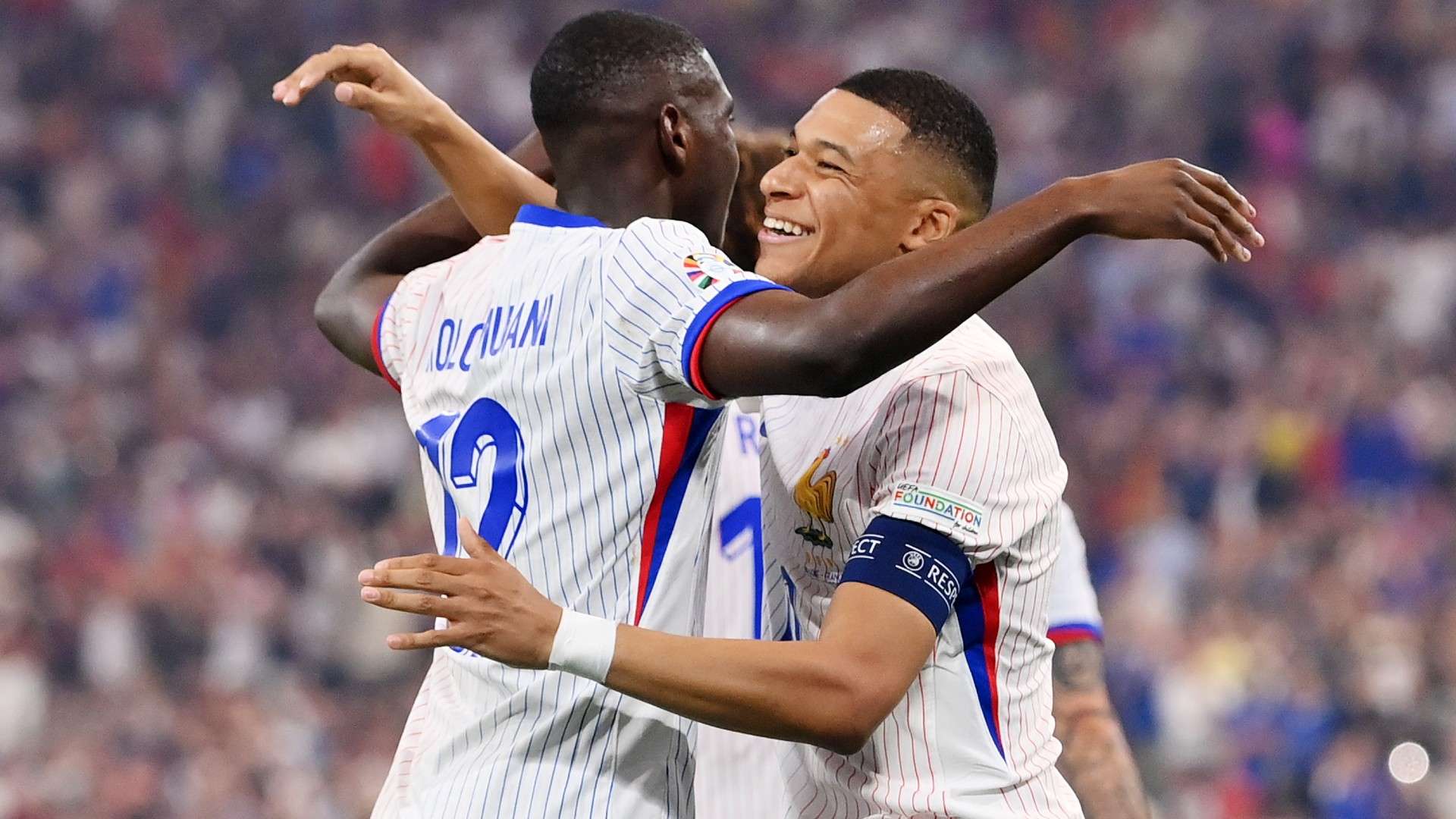 Randal Kolo Muani celebrates scoring his team's first goal with teammate Kylian Mbappe of France