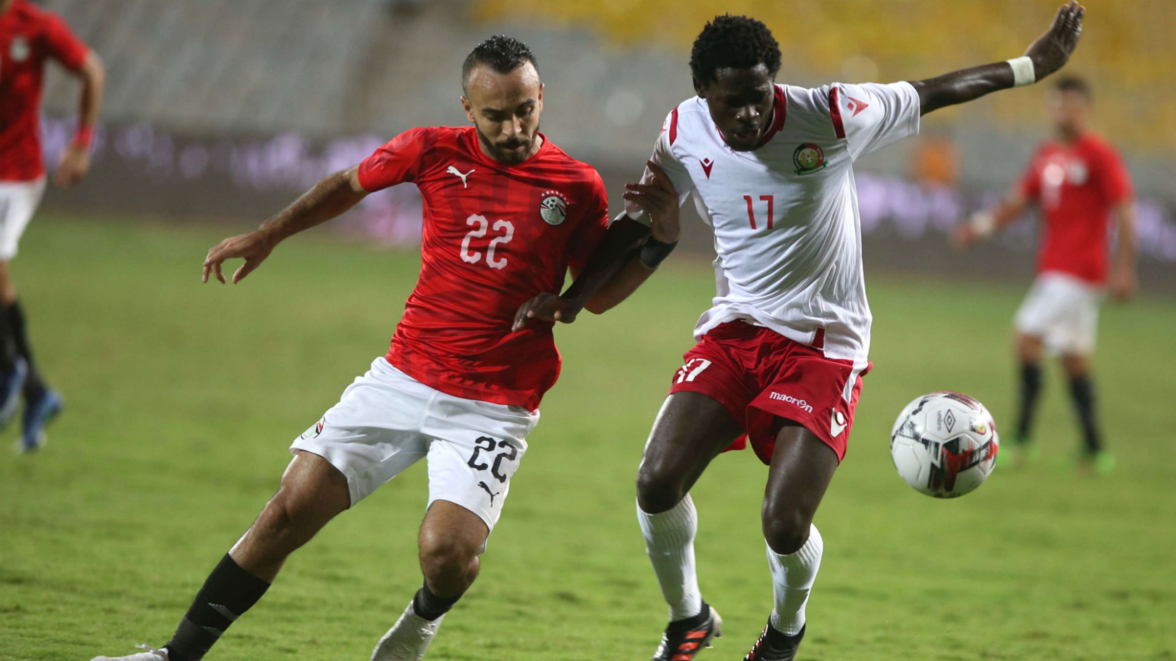 Kenya and Harambee Stars defender Lawrence Juma (r) in action against Egypt's Mohamed Afsha.