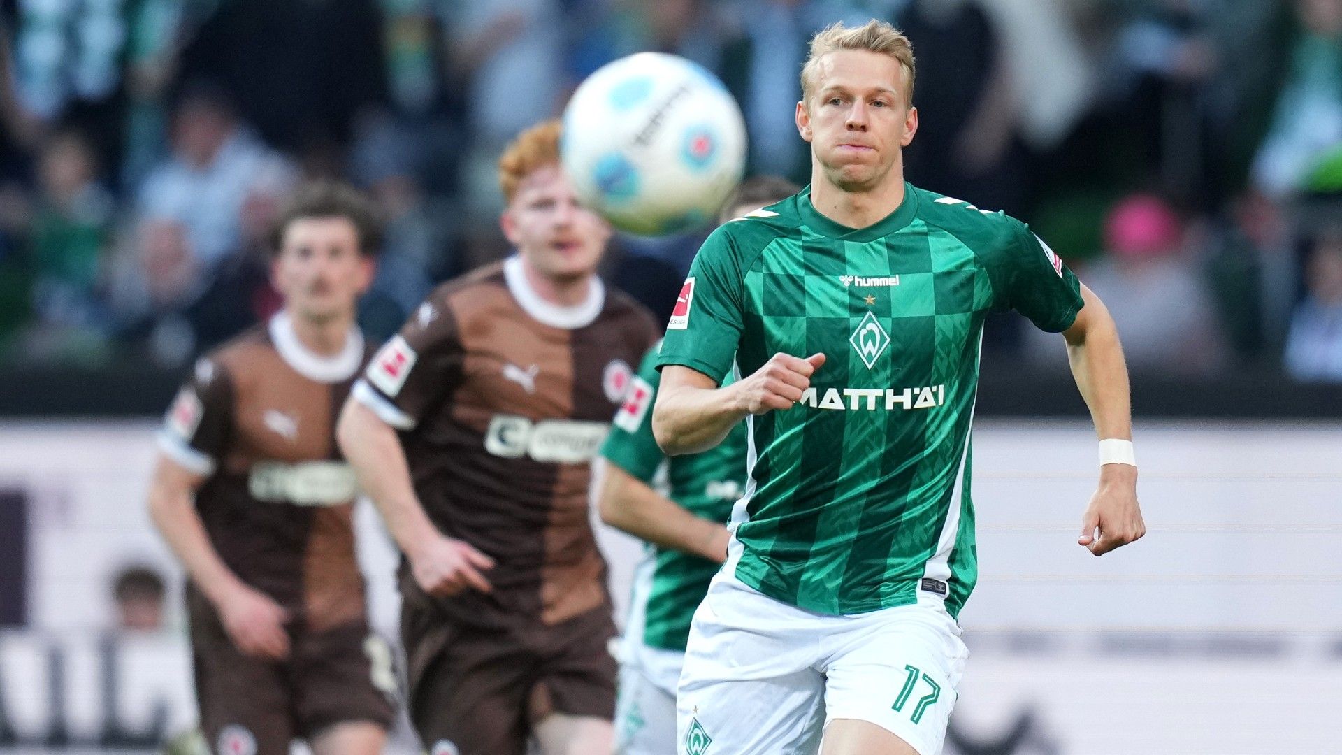 Marco Grüll #17 of SV Werder Bremen chases the ball