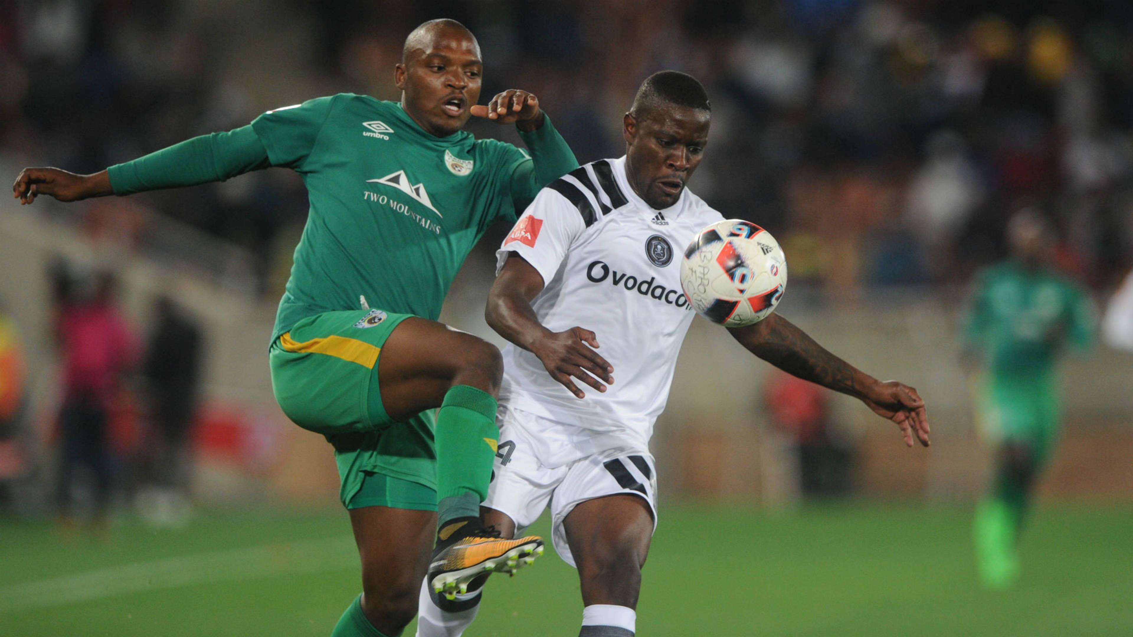 Ntsikelelo Nyauza of Orlando Pirates is challenged by Gift Motupa of Baroka FC