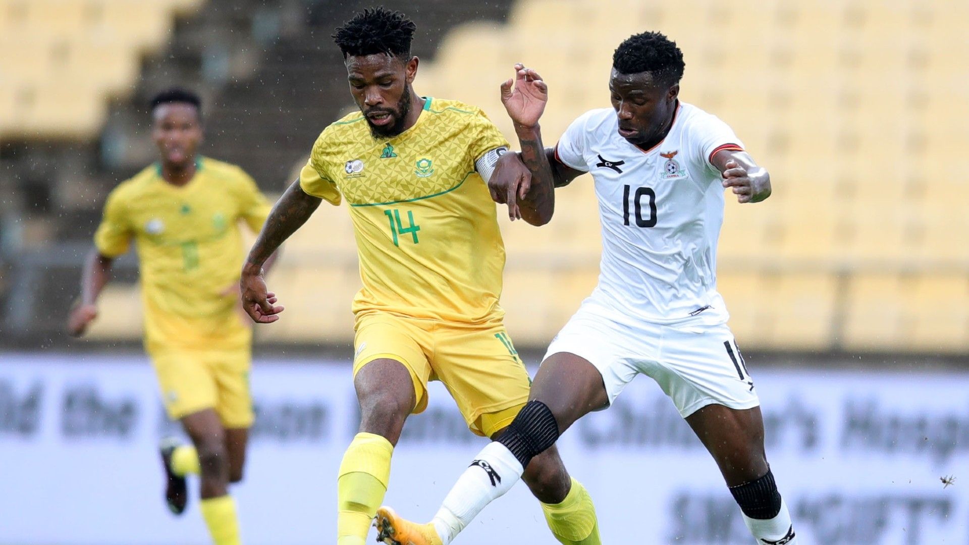 Thulani Hlatswayo of South Africa challenged by Fashion Sakala of Zambia.