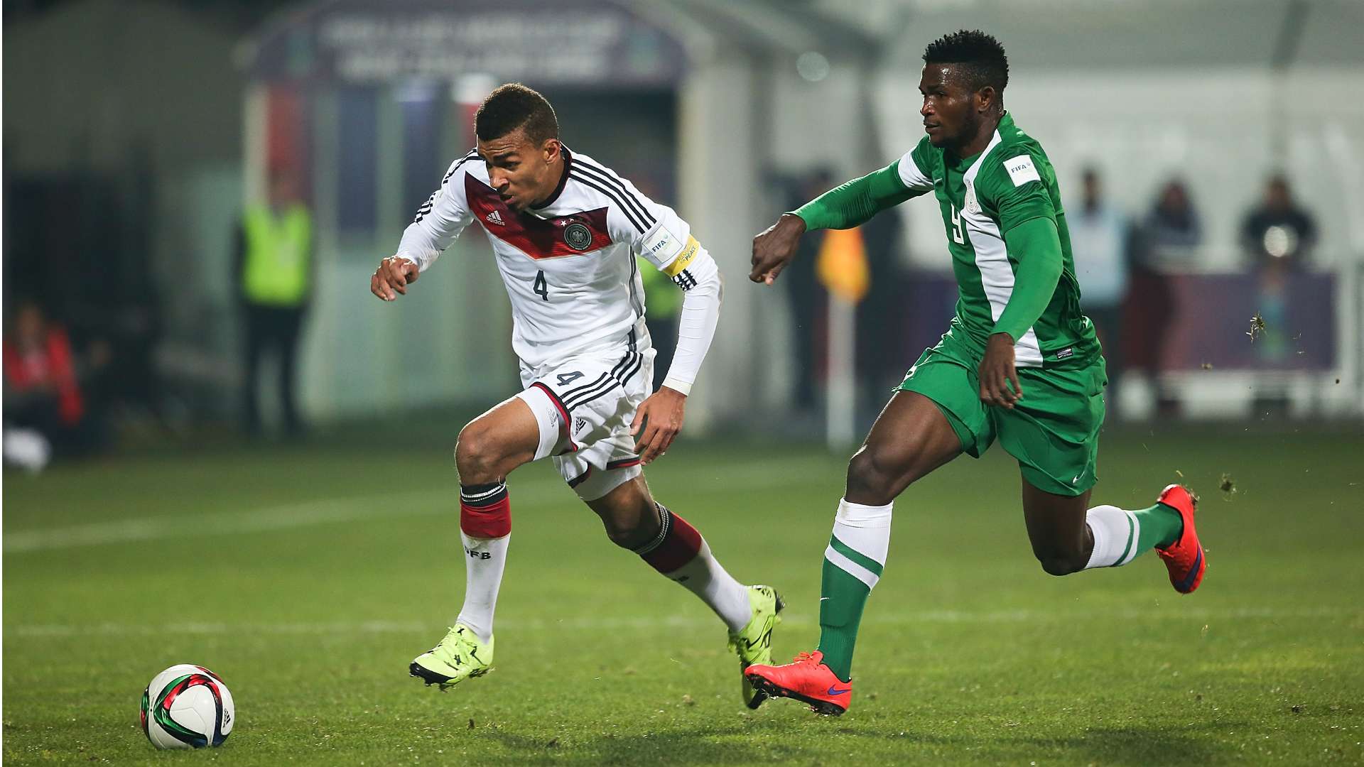 Kevin Akpoguma chased by Nigeria's Isaac Success