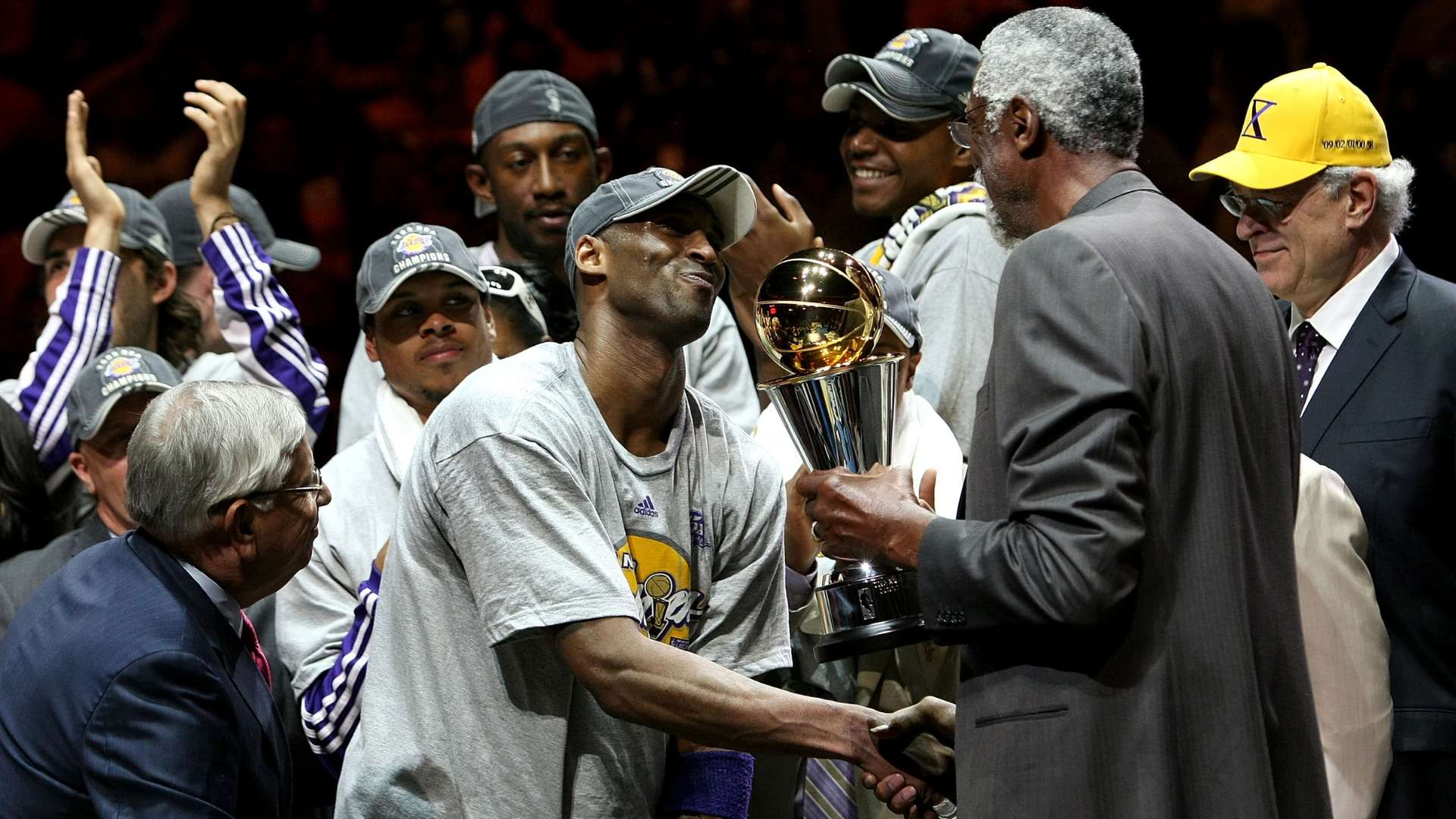 Kobe Bryant and Bill Russell with MVP trophy 