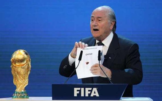 FIFA president Joseph Blatter opens the envelope to reveal that Qatar will host the 2022 World Cup