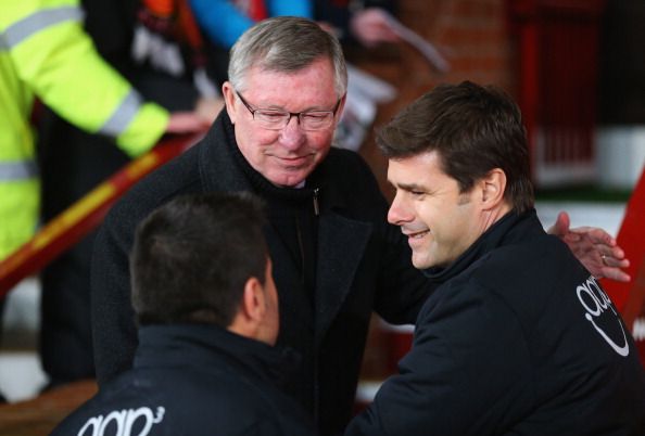Sir Alex Ferguson manager of Manchester United shakes hands with Mauricio Pochettino manager of Southampton