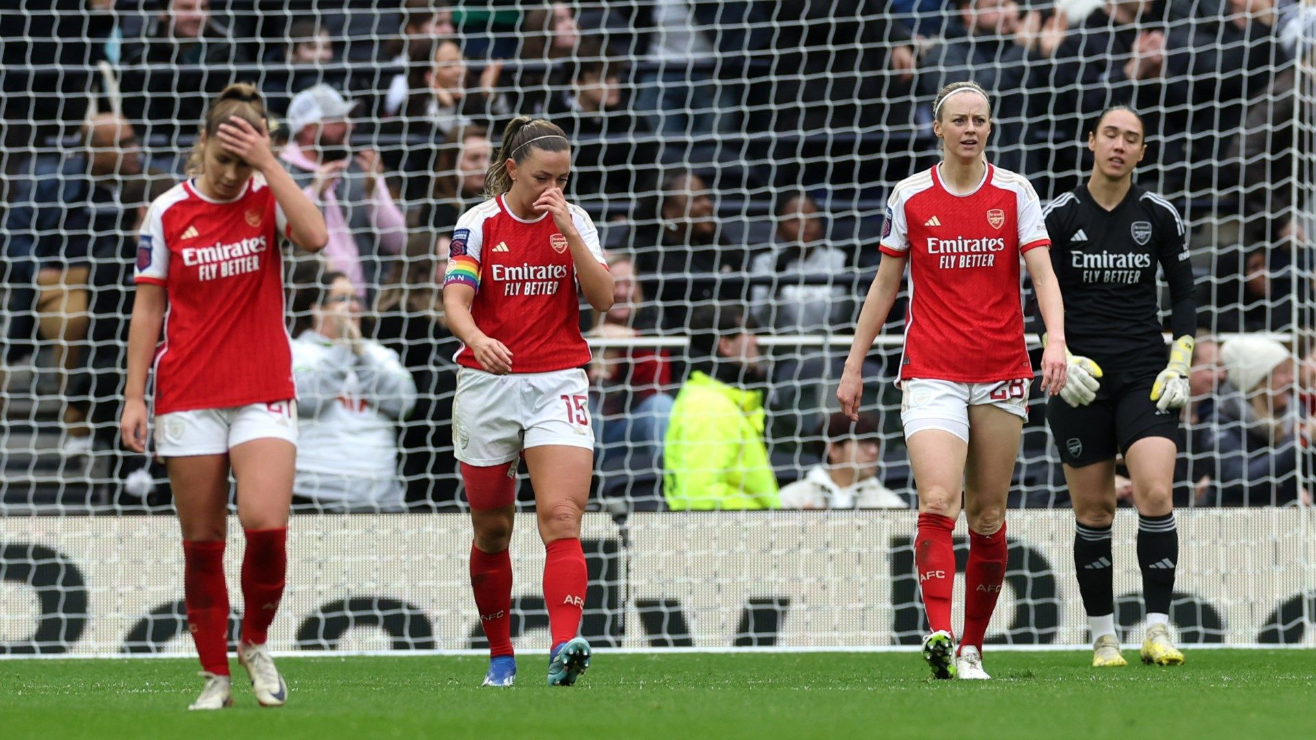 Arsenal women look dejected after conceding a goal against Tottenham 2023-24