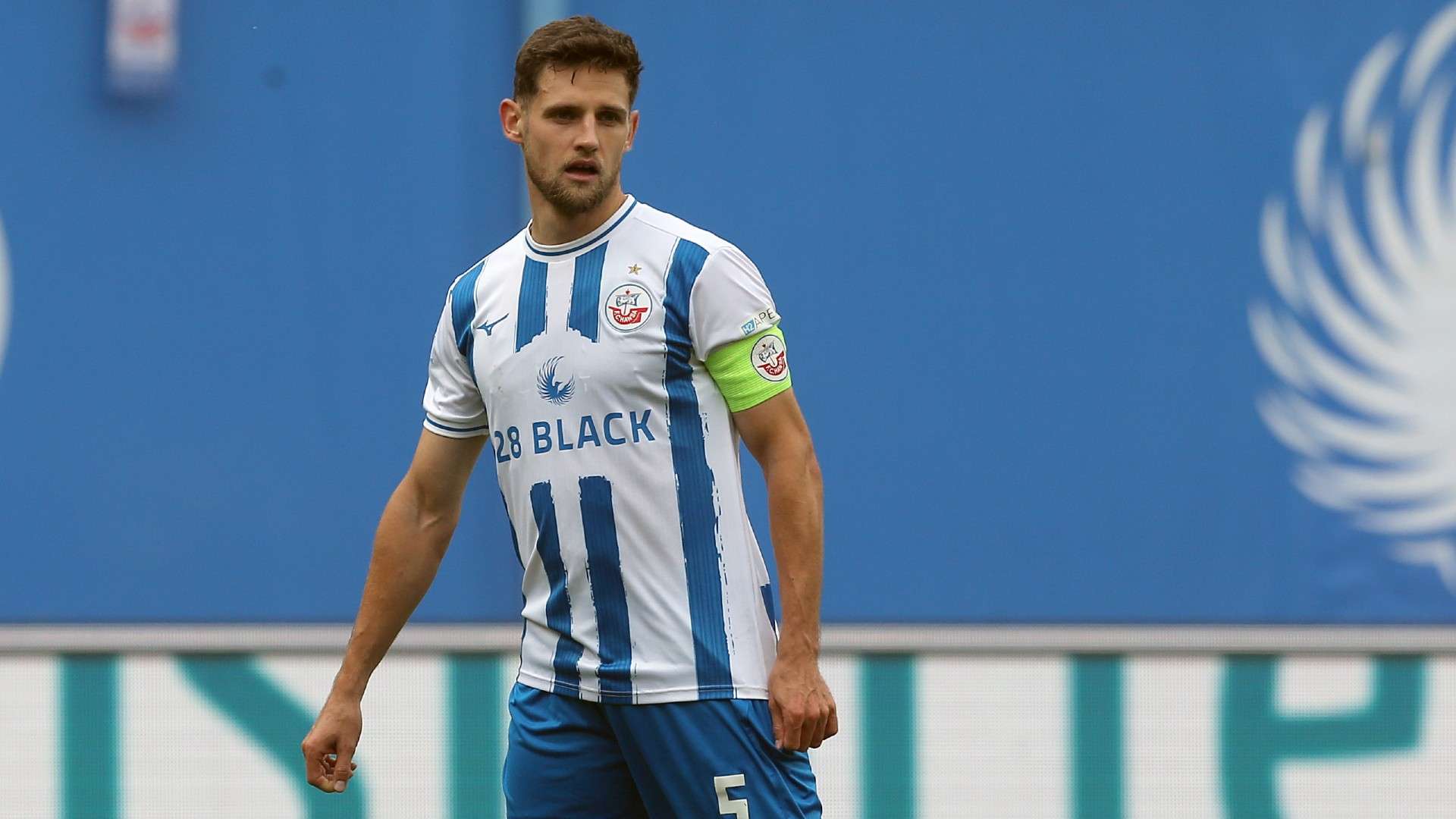 Marco Schuster of Rostock looks on