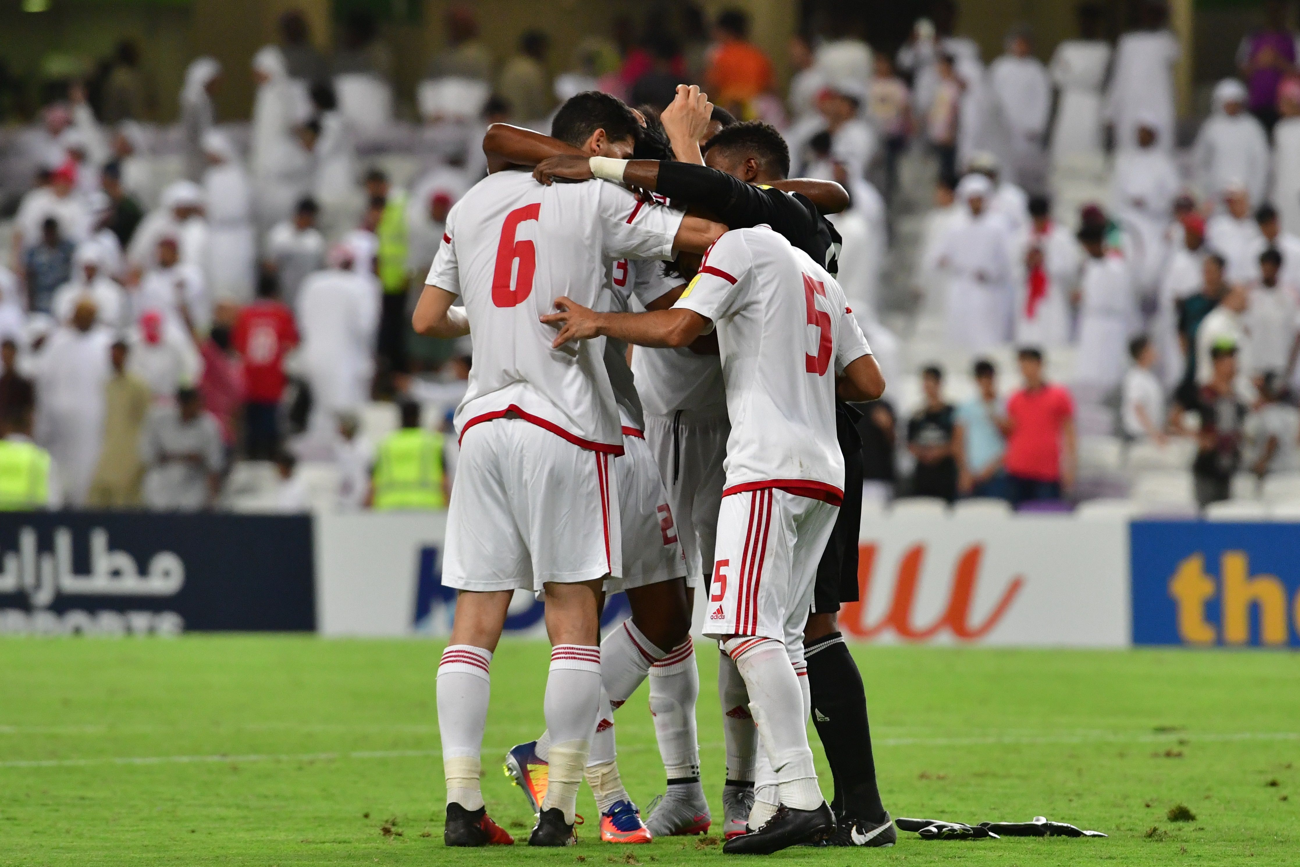 UAE players celebrate a.