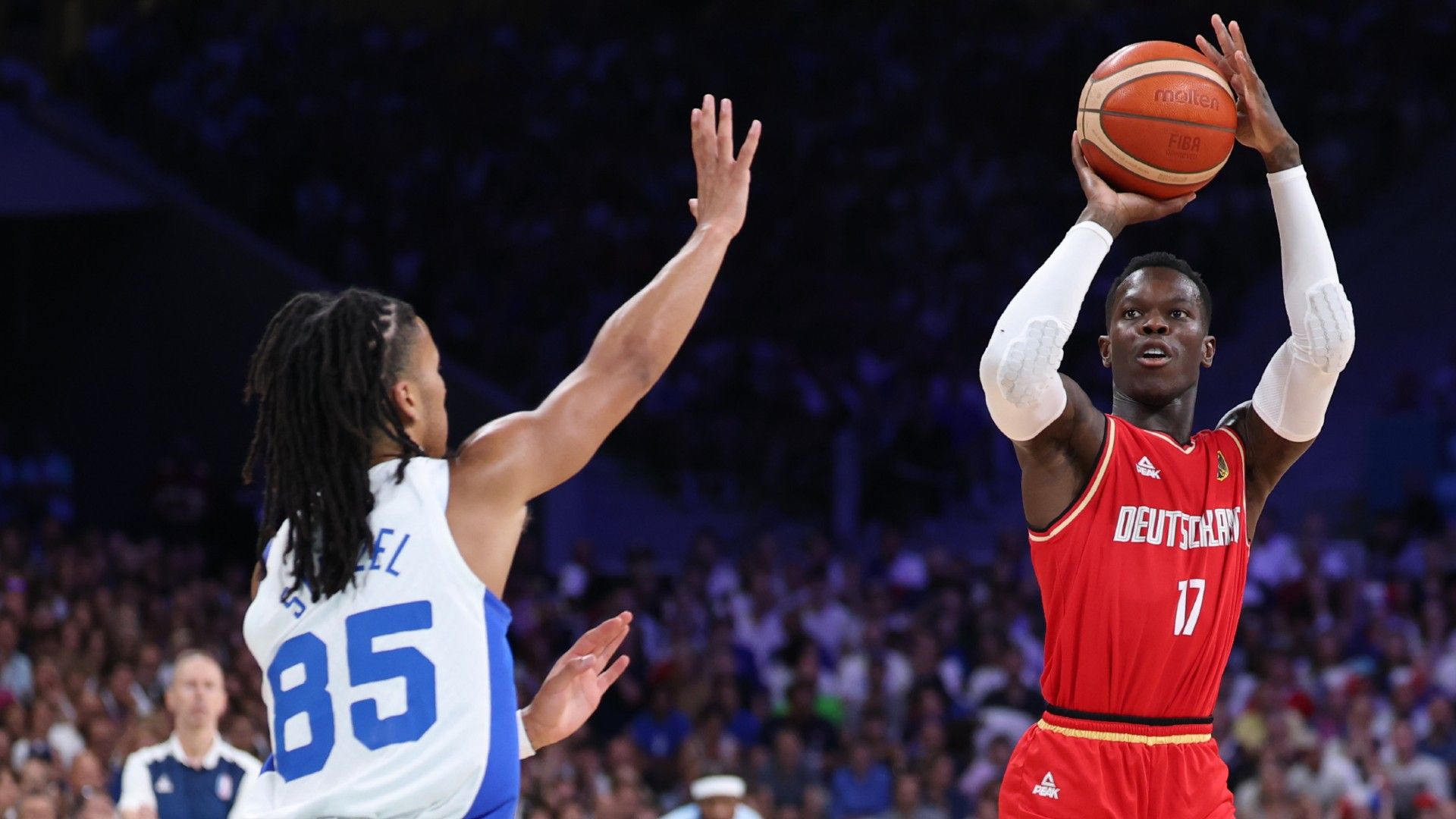 Dennis Schroder #17 of Team Germany shoots over Matthew Strazel #85 of Team France