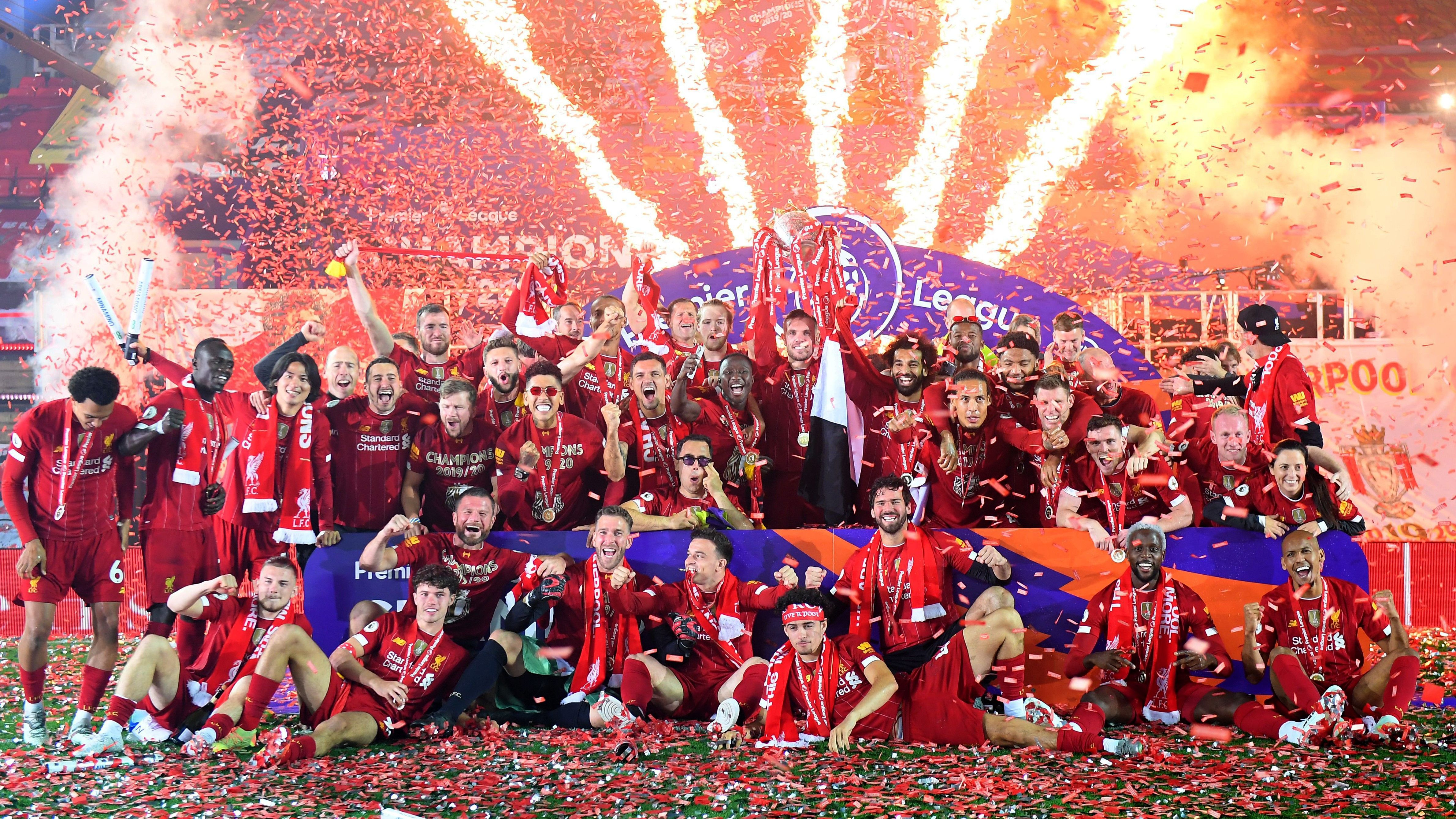 Liverpool lifts The Premier League trophy following the Premier League match between Liverpool FC and Chelsea FC at Anfield on July 22, 2020