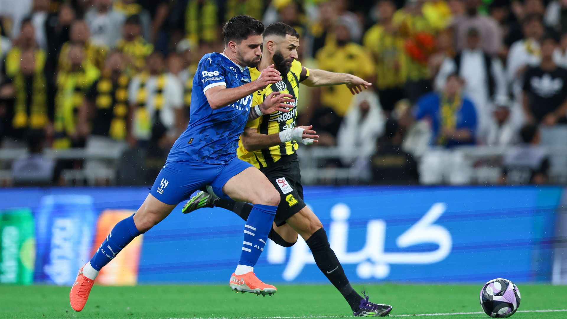 Karim Benzema of Al Ittihad is challenged by Ruben Neves of Al Hilal