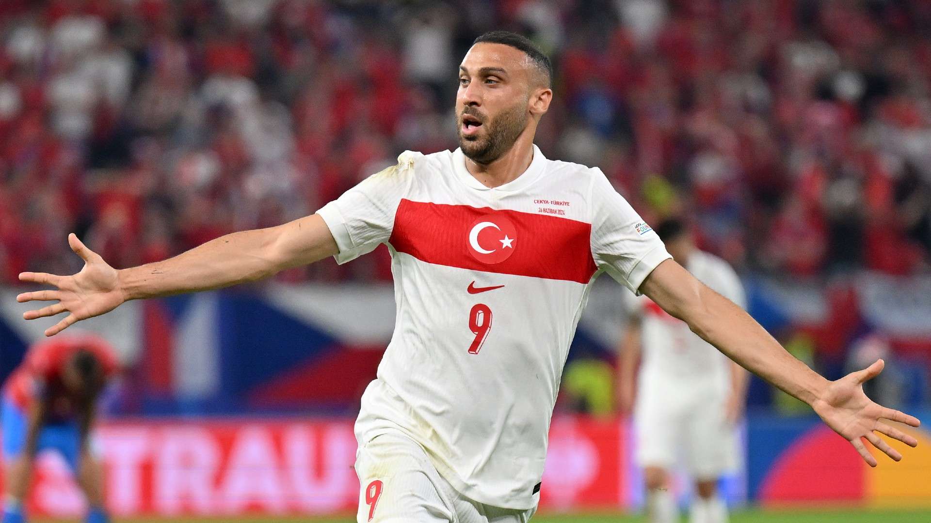 Turkey's forward #09 Cenk Tosun celebrates scoring