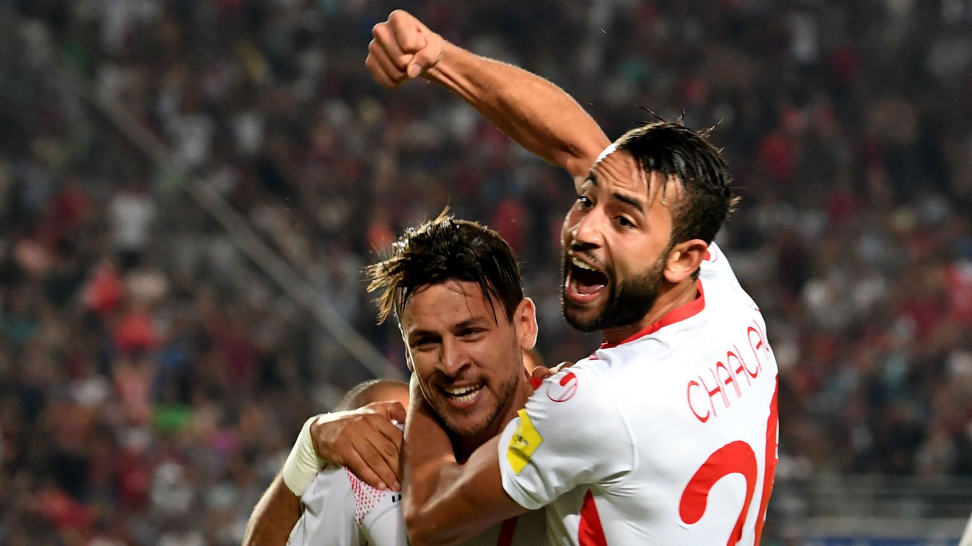 Tunisia's forward Ghailene Chaalali (R) celebrates with Youssef Msakni after scoring a goal