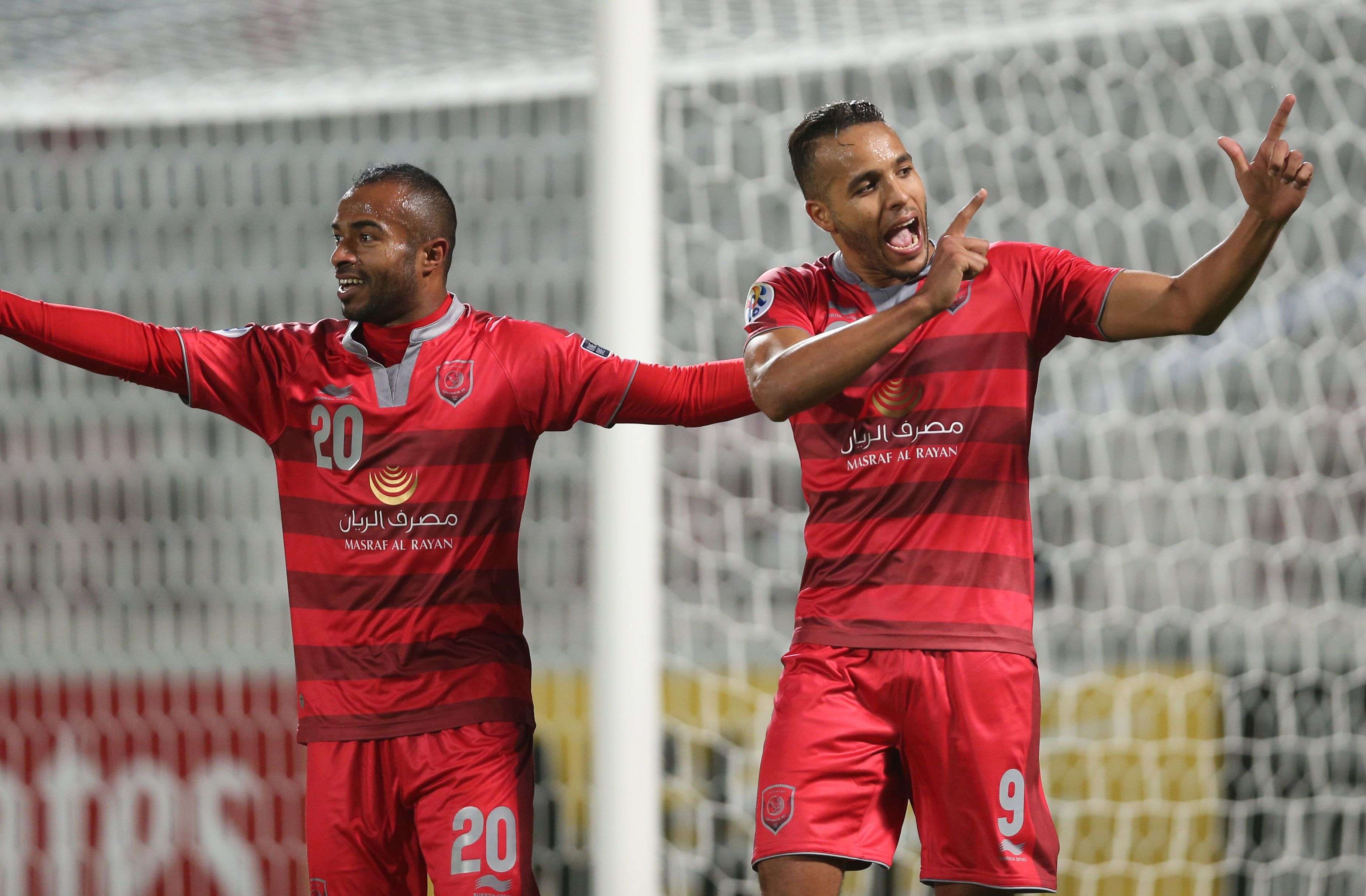 Qatar's Lekhwiya players Ali Hassan Afif (L) and Youssef El-Arabi celebrate