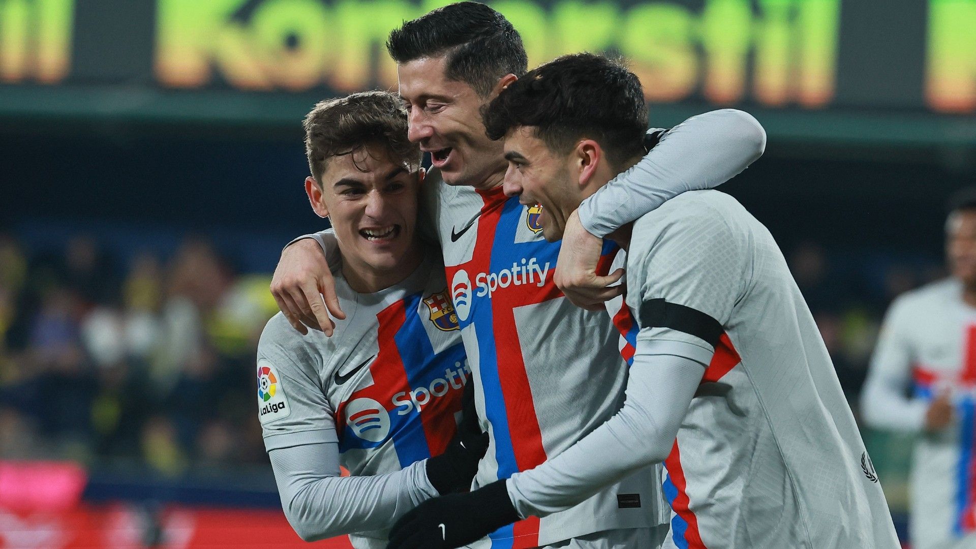 Barcelona's Spanish midfielder Pedri (R) celebrates with Barcelona's Spanish midfielder Gavi and Barcelona's Polish forward Robert Lewandowski (C)