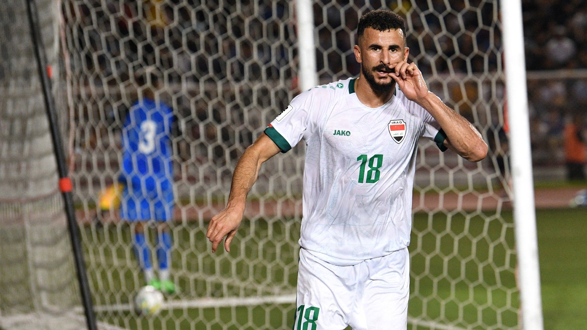 Iraq's Aymen Hussein reacts after a goal against the Philippines