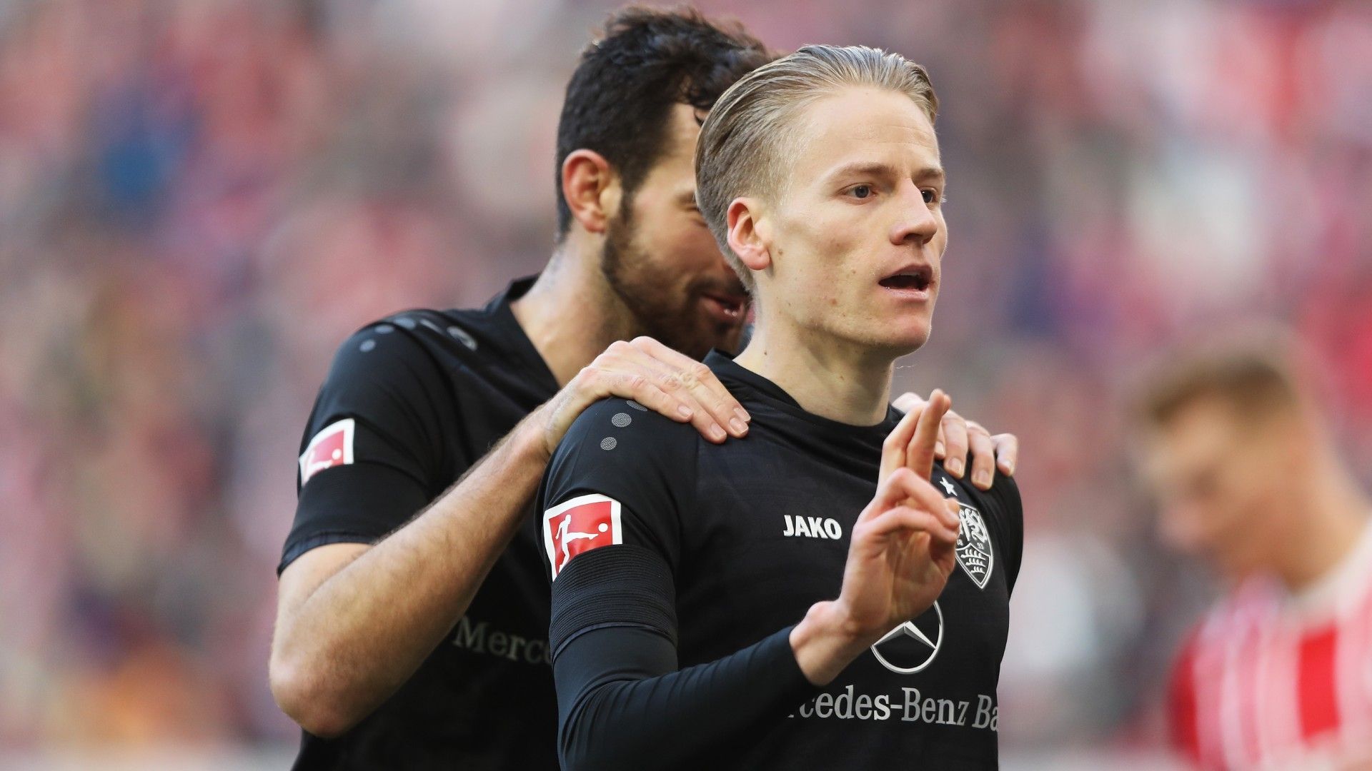 Chris Fuehrich of VfB Stuttgart celebrates with teammate Luca Pfeiffer