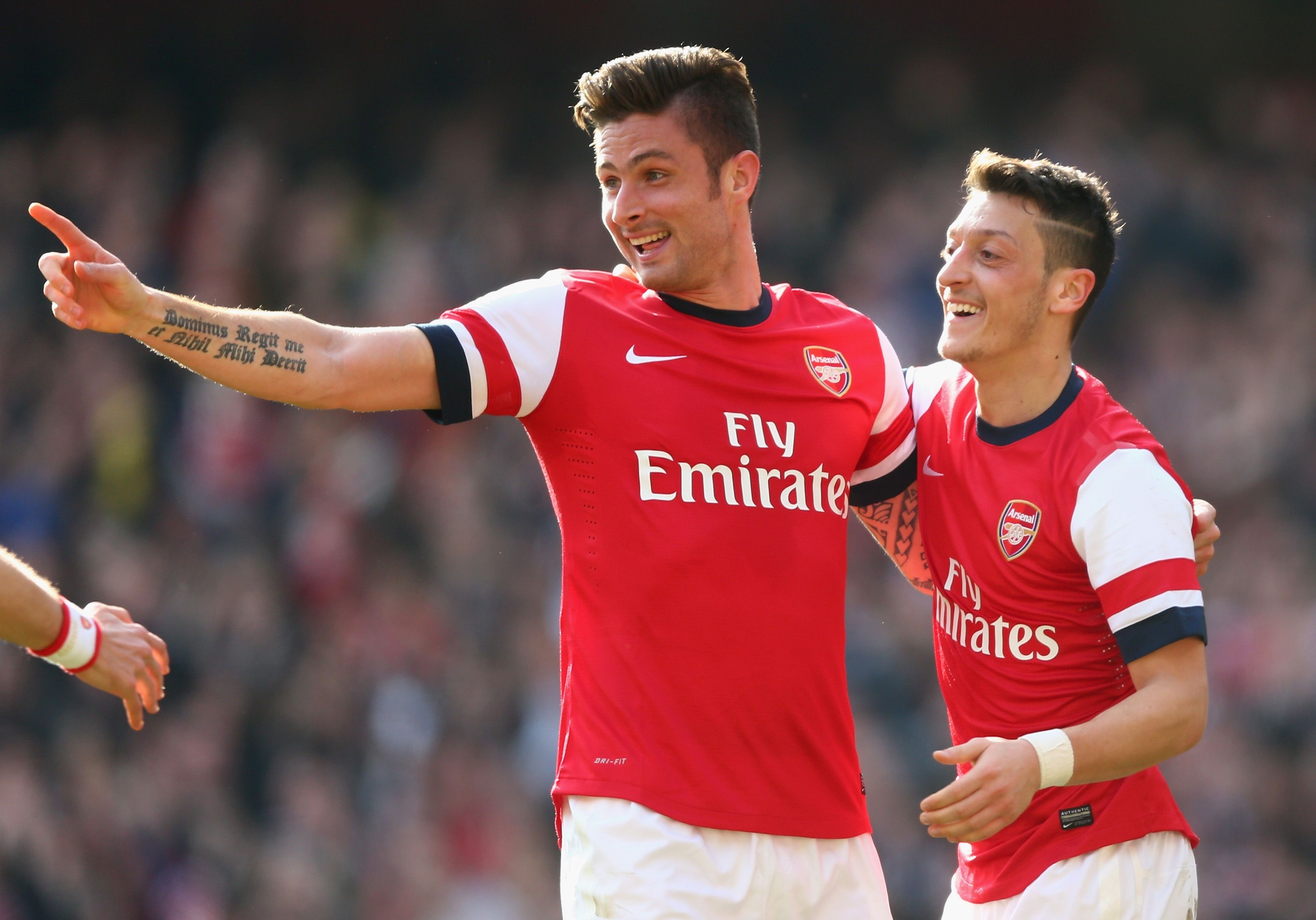 Arsenal pair Olivier Giroud (L) and Mesut Ozil