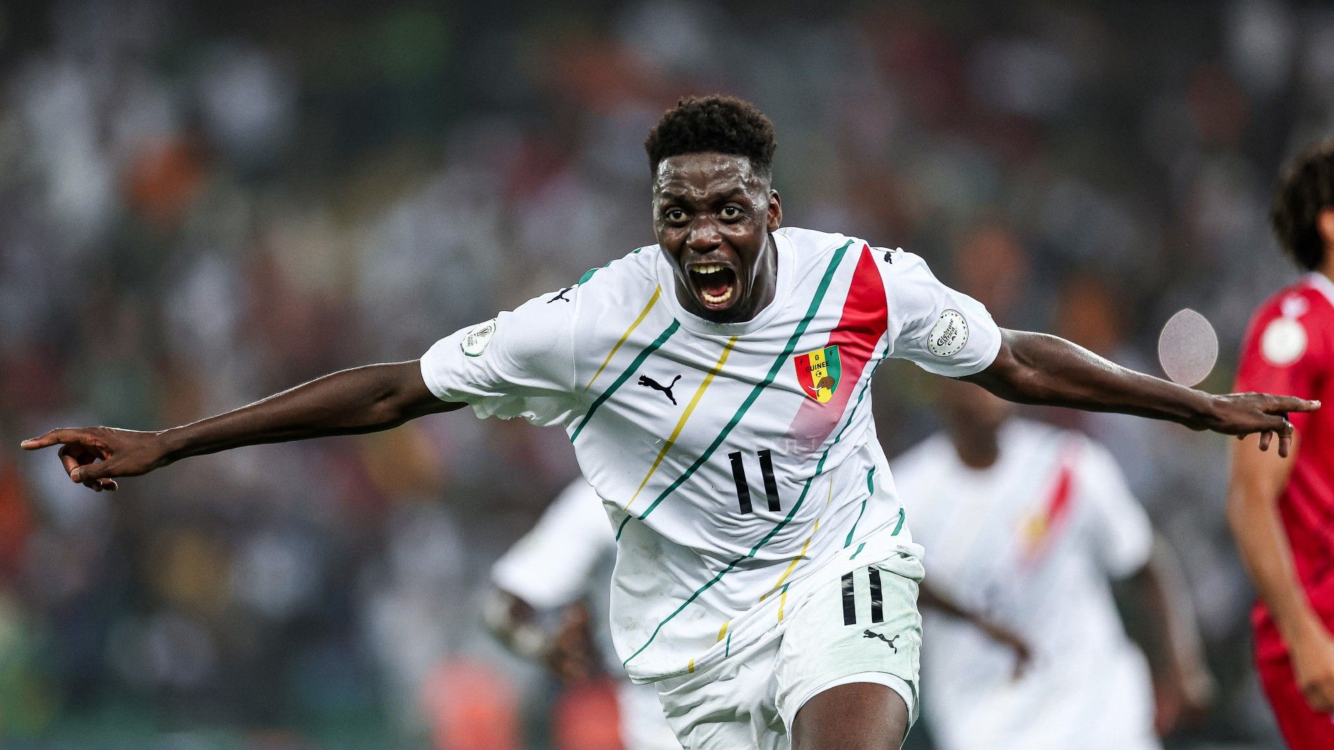 Guinea's midfielder #11 Mohamed Bayo celebrates