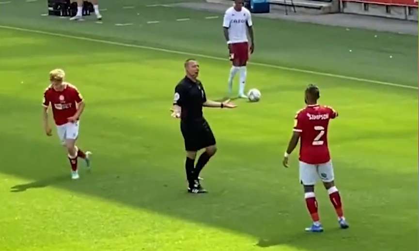 Referee shows fans yellow card